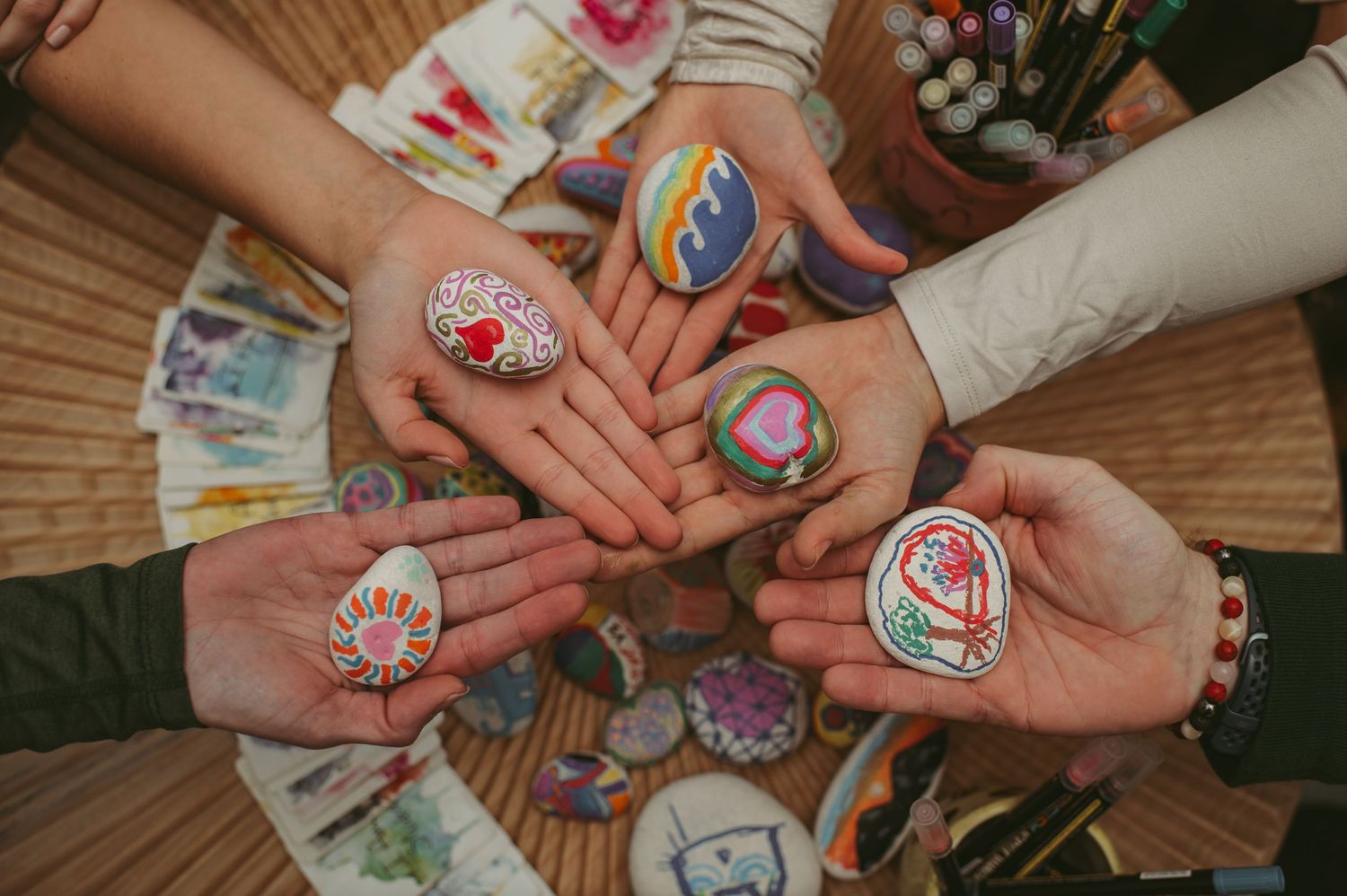 Painted rocks being captured at a wellness retreat for branding image purposes in Virginia Beach.
