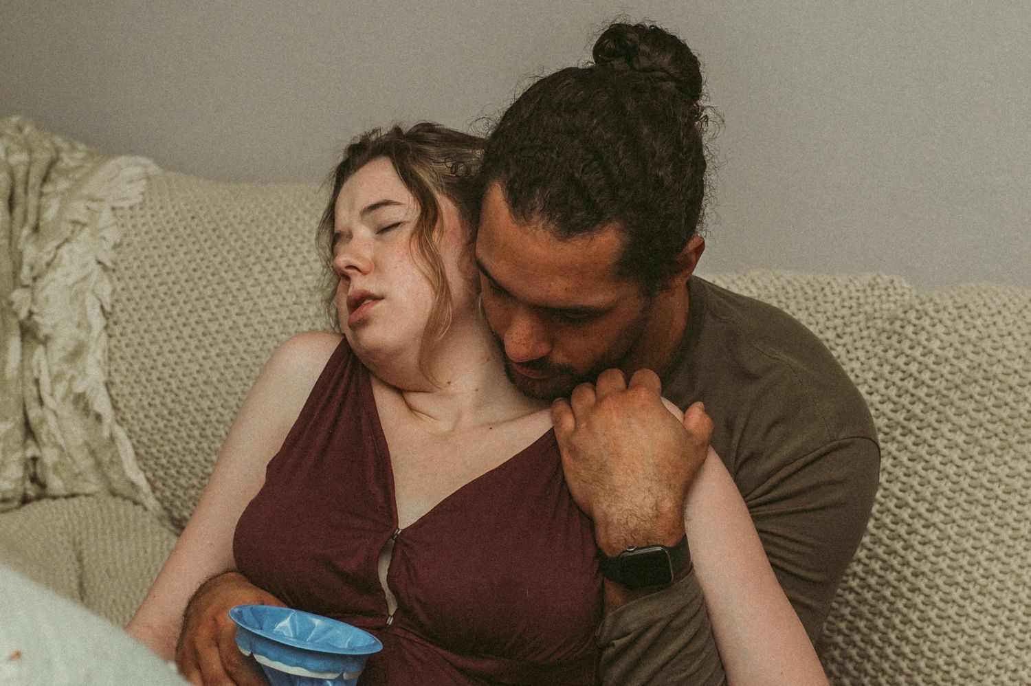 A loving partner supporting his wife during a hard contraction in their home in Portsmouth, Virginia.