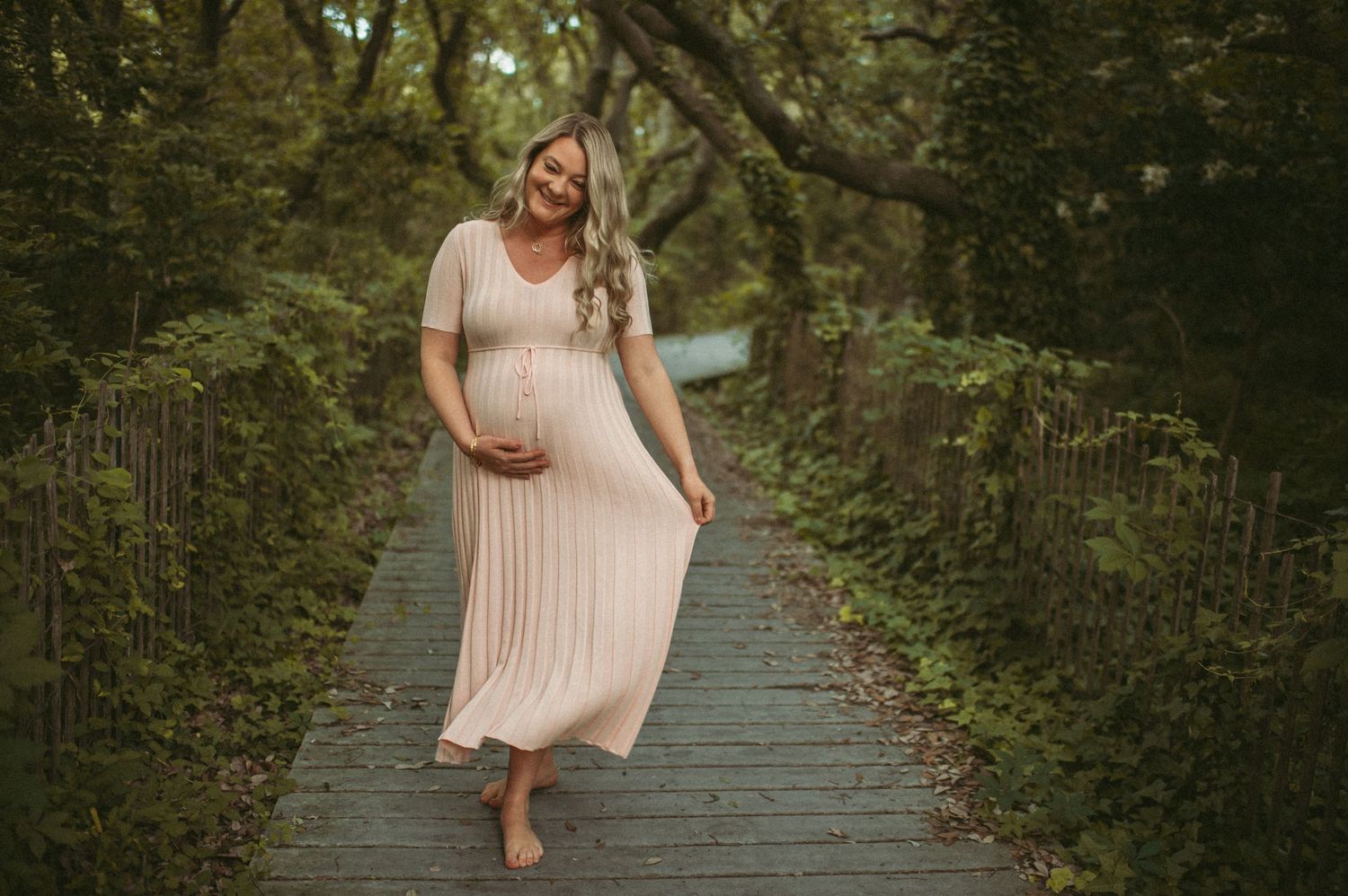 Expecting mother posing during her maternity session in Virginia Beach.