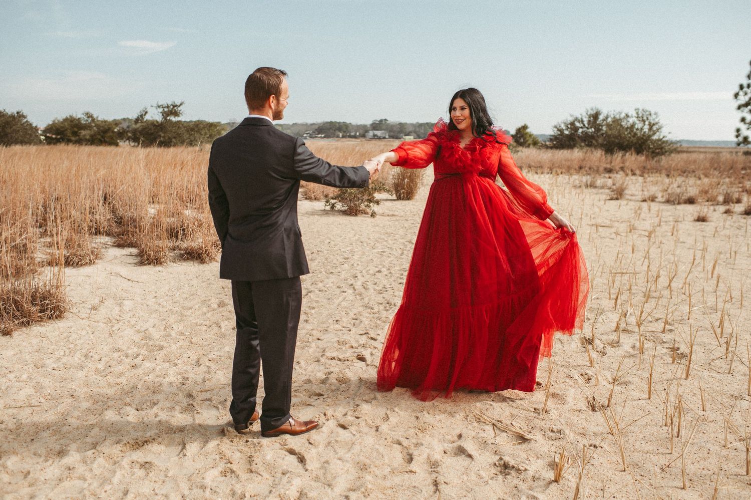 Expecting Norfolk, Virginia couple having a dance in Virginia Beach during their maternity session.
