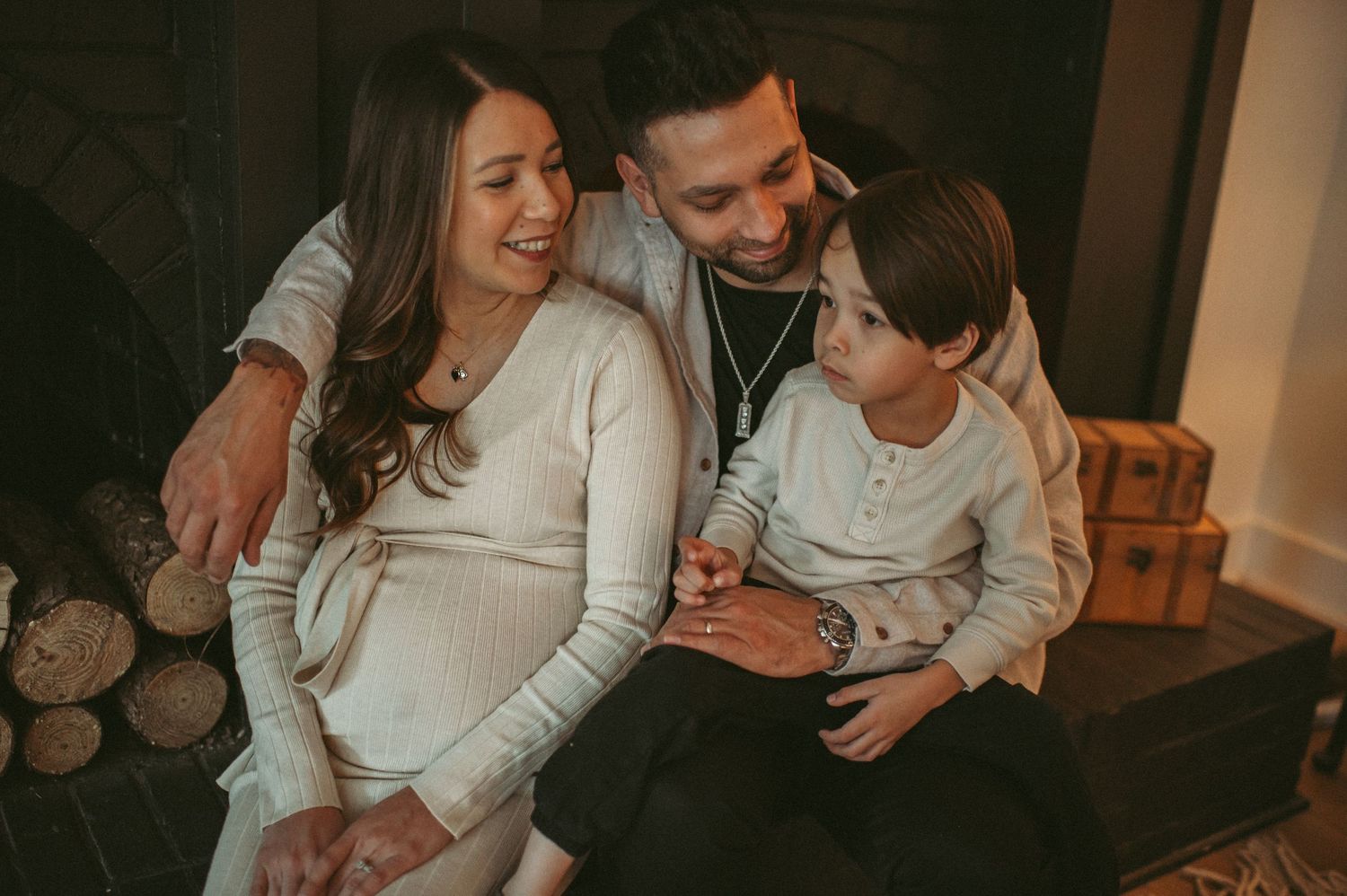 Expecting family sharing a sweet moment at a local studio in Chesapeake, Virginia.