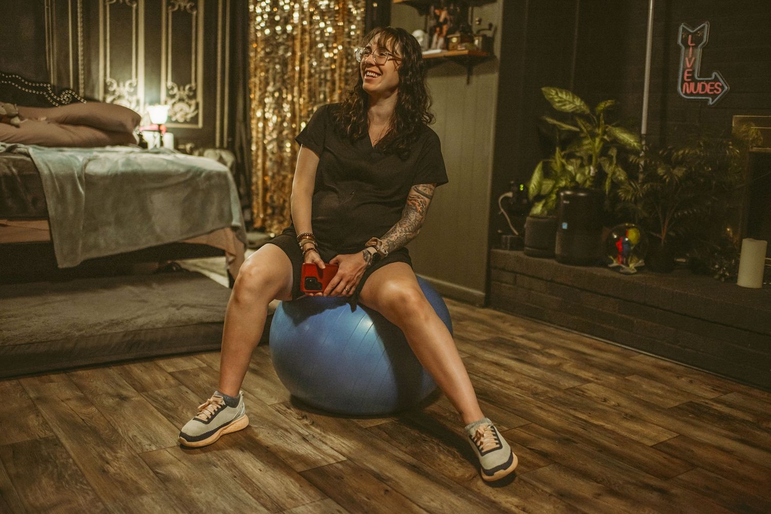 Expecting mom bouncing on her pregnancy ball while having early contractions in her Newport News home.