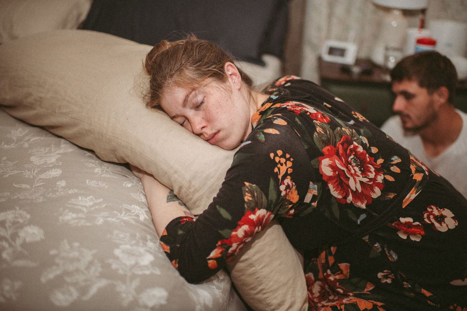 Laboring mom hugging her pregnancy pillow while she takes a quiet moment between contractions in her N.C. home.