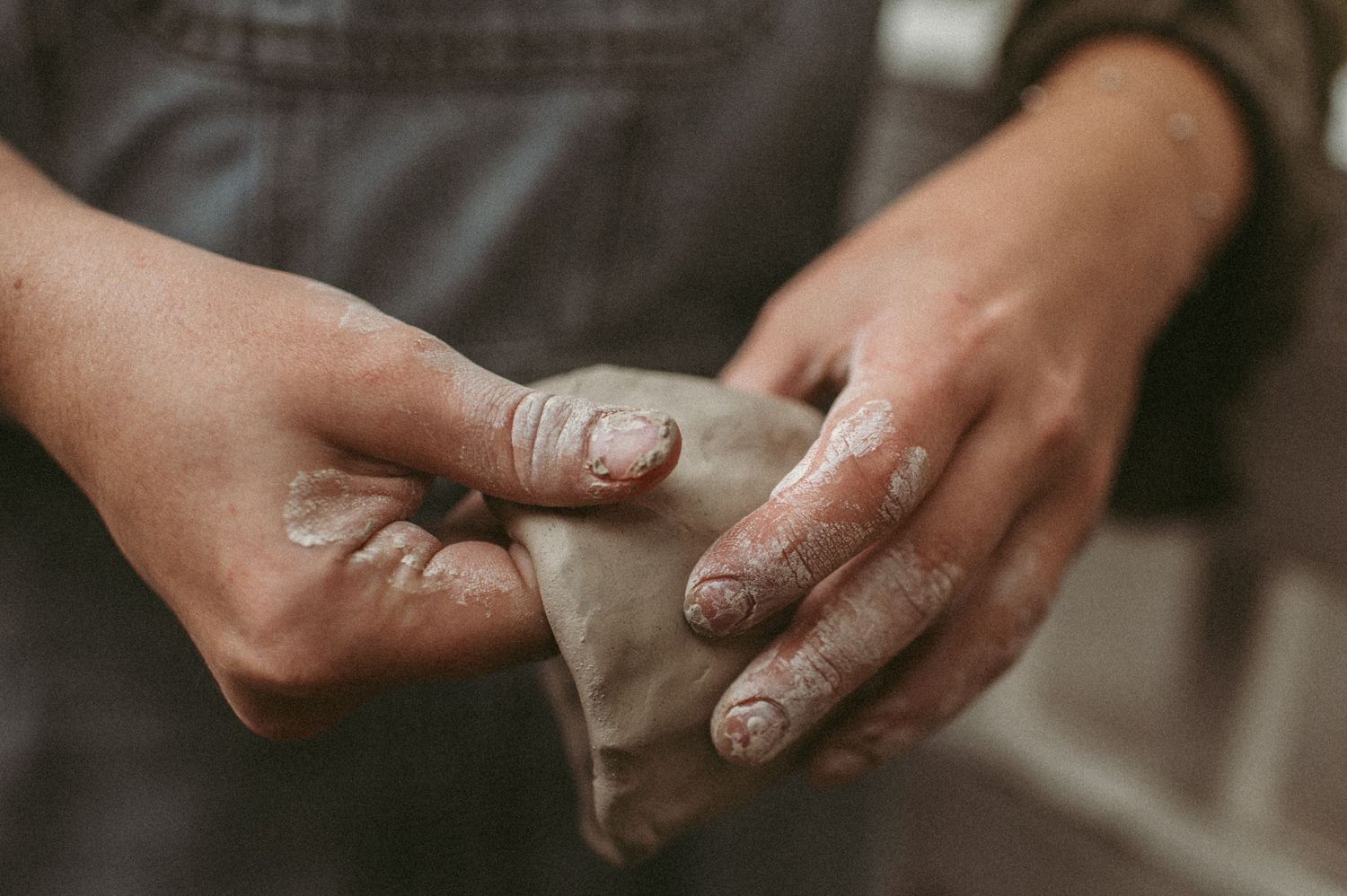 Branding client showing off their pottery skills during a branding session in Virginia Beach.