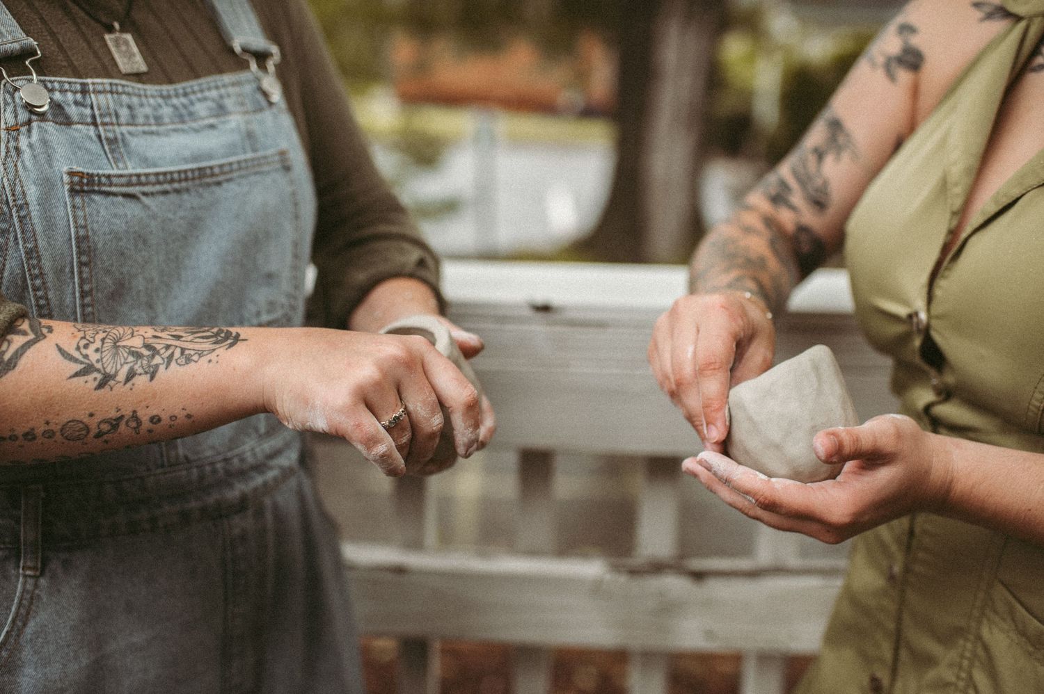 Branding clients showing off their pottery skills during a branding session in Virginia Beach, Virginia.