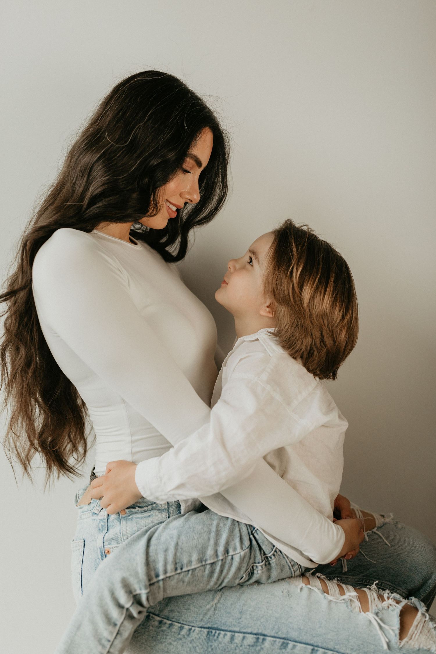A british columbia elopement photographer and her son looking lovingly into each others eyes.