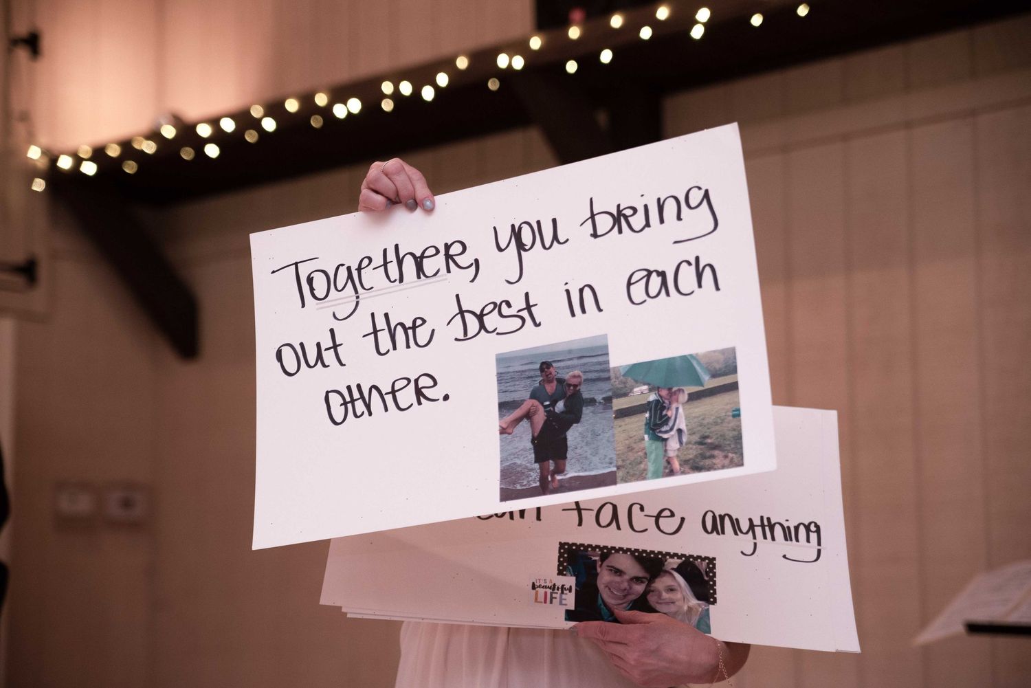 A handmade wedding sign reads Together you bring out the best in each other with photos of a couple attached.