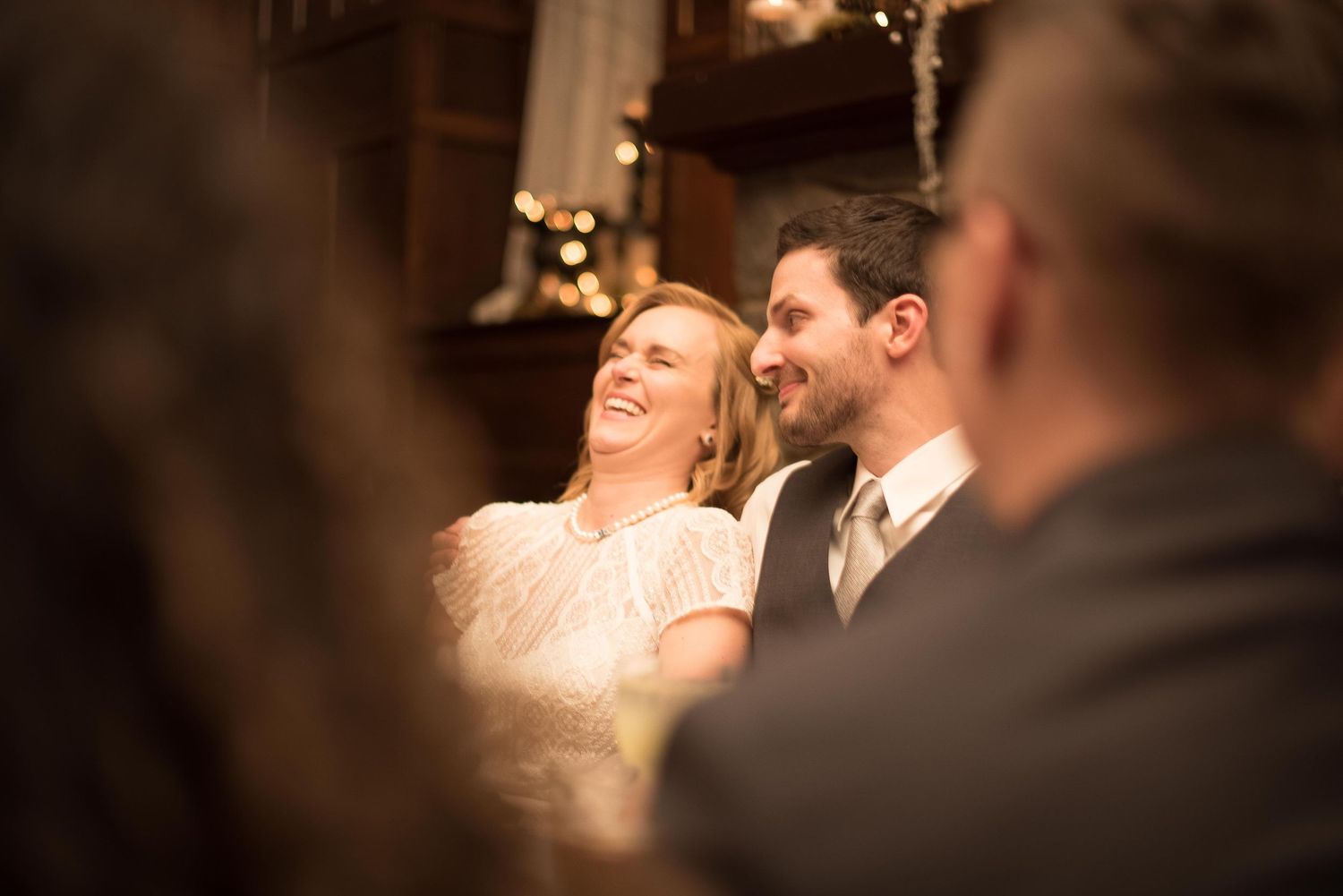 Smiling bride and groom sharing a joyful moment during their wedding ceremony.
