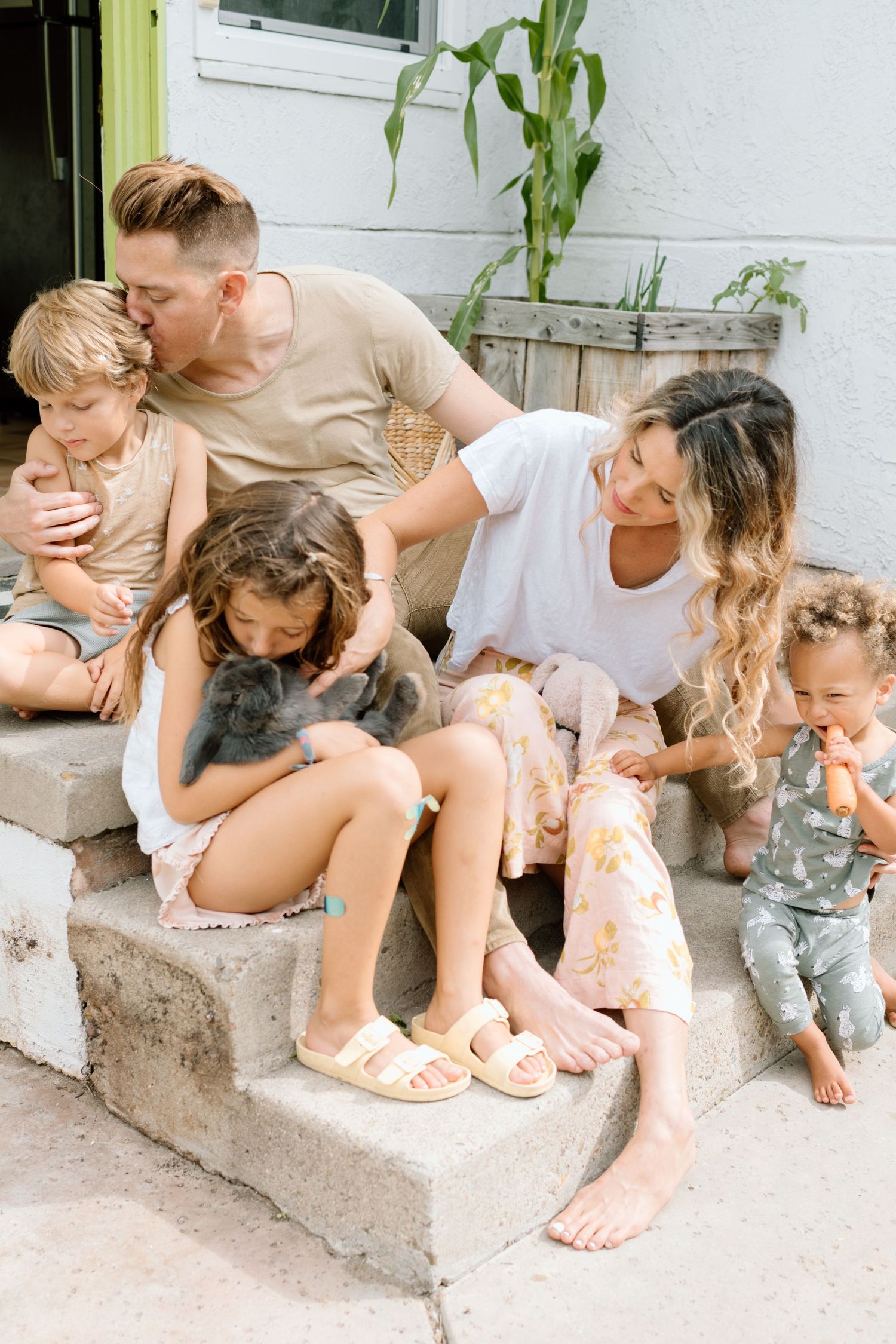 Family on back porch during at home family photoshoot in San Diego.