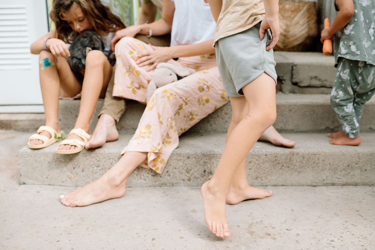 Family legs during at home family photoshoot in San Diego.