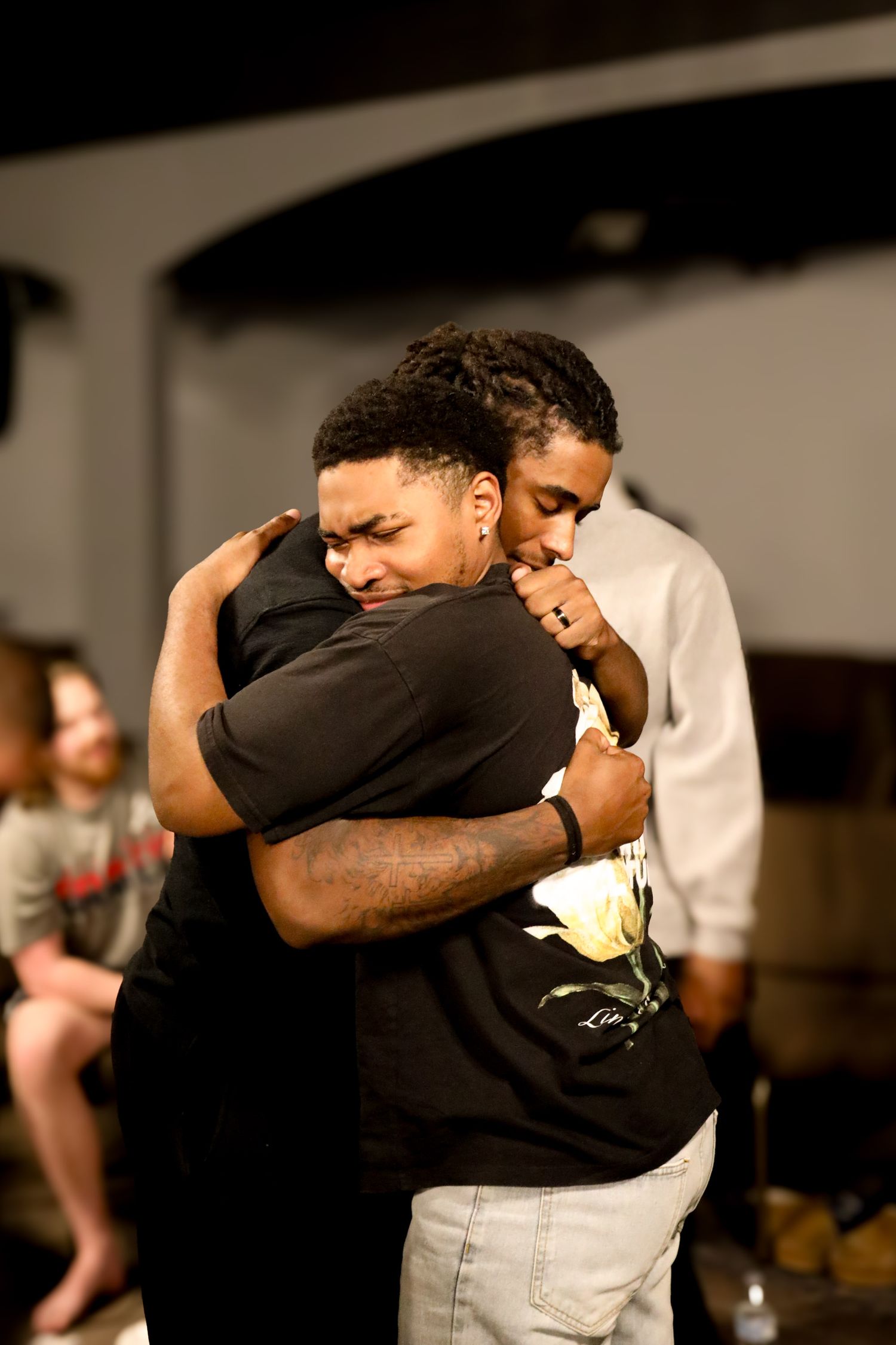 2 men embracing each other