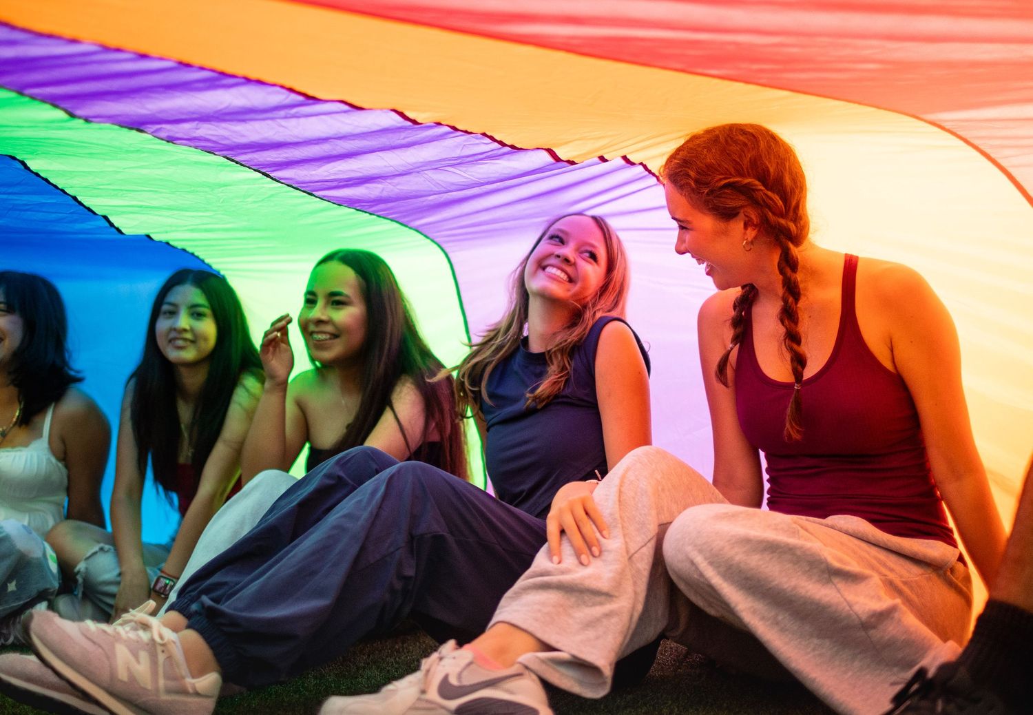 R.L. Paschal High School student participates in the school's annual Senior Sunrise by smiling big under a parachute.