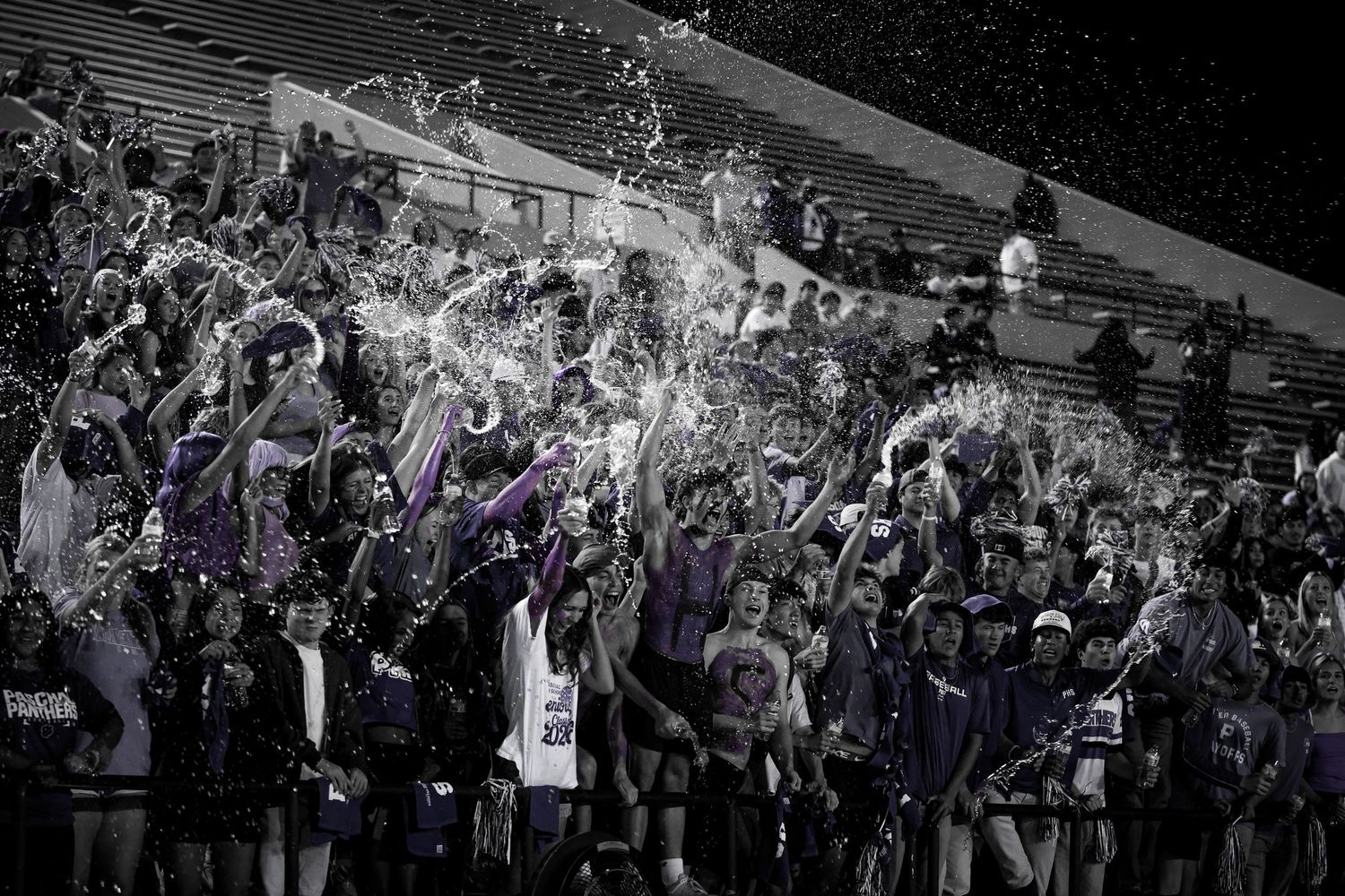 R.L. Paschal High School's student section bursts into excitement after their Varsity Football team scores against rivals Arlington Heights.