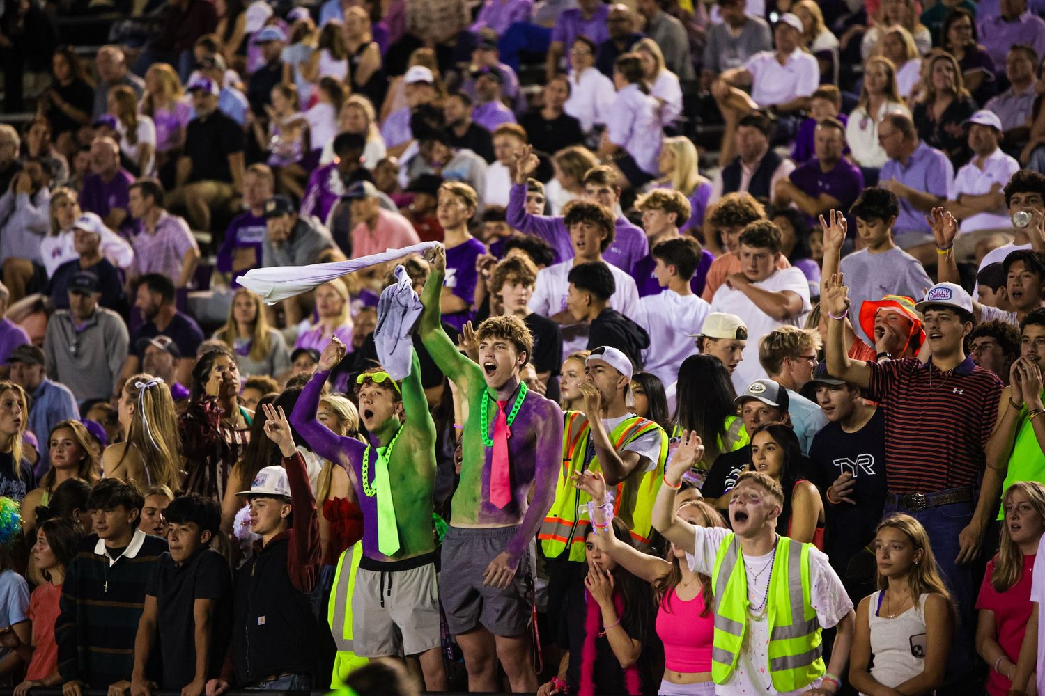 R.L. Paschal High School students cheer on the team at the Homecoming game as the Varsity Football team had just score a touchdown.