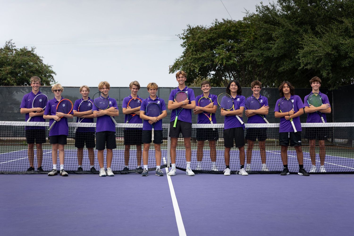 R.L. Paschal High School Varsity Men's Tennis Team poses for a group photo on the Paschal High School tennis courts.