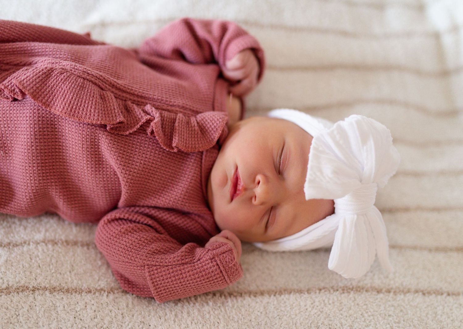 Newborn baby with parents during a Fresh 48 session in Lake Saint Louis Missouri