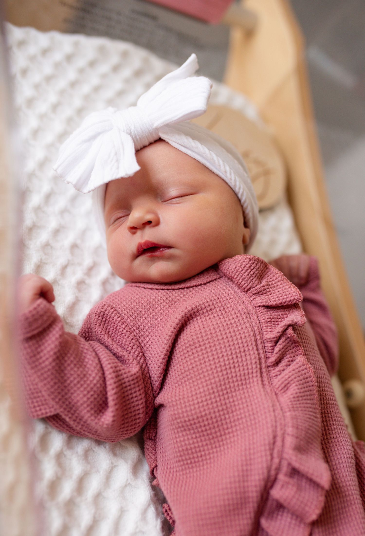 Newborn baby with parents during a Fresh 48 session in Lake Saint Louis Missouri