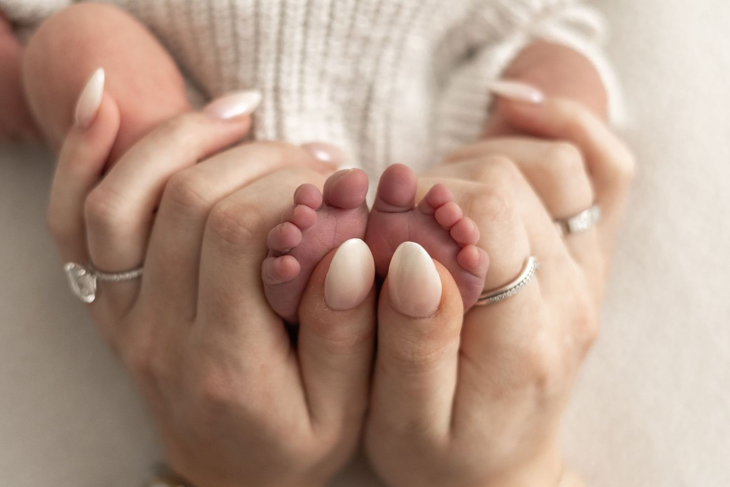 Newborn photography Nottingham baby close up tiny feet and mums hands detail shot