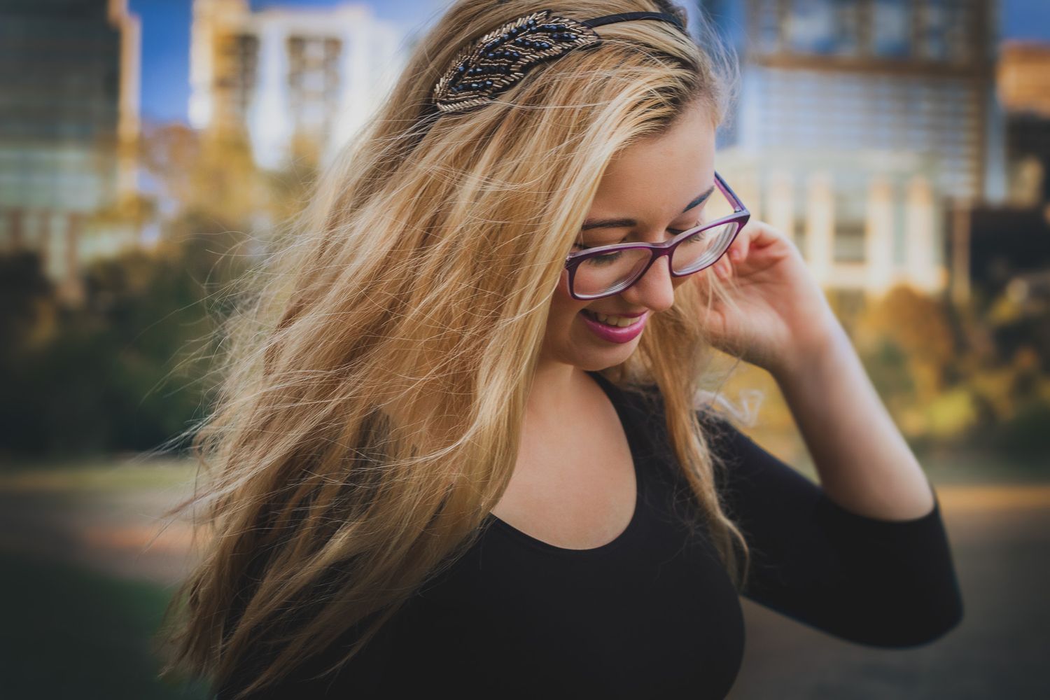 Candid senior portrait of a teenage girl with windswept hair, natural light outdoor photography, Finger Lakes NY, Soft Wild Light.