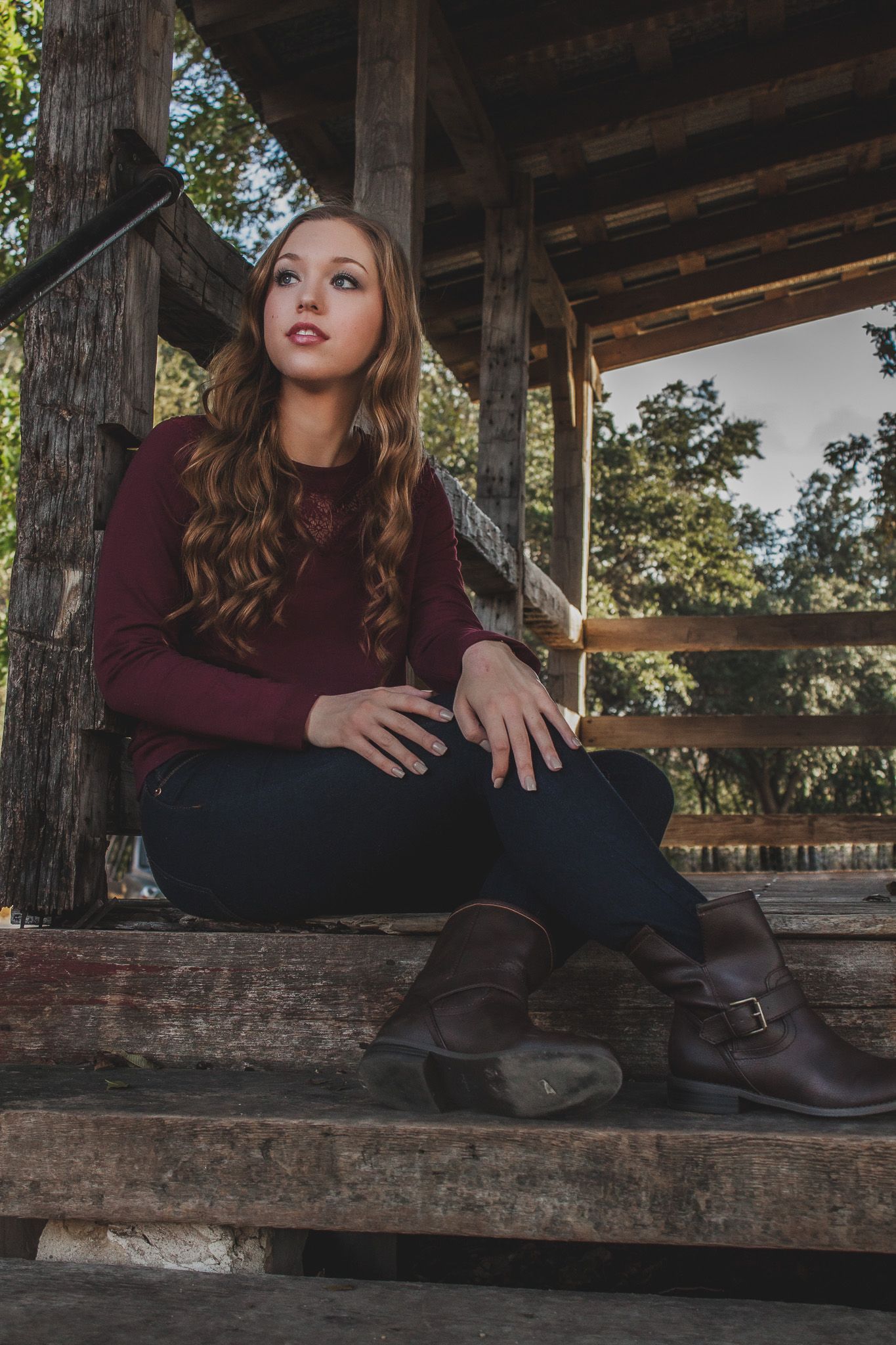 Senior portrait of a teenage girl sitting on wooden steps outdoors, natural light photography, Finger Lakes NY, Soft Wild Light