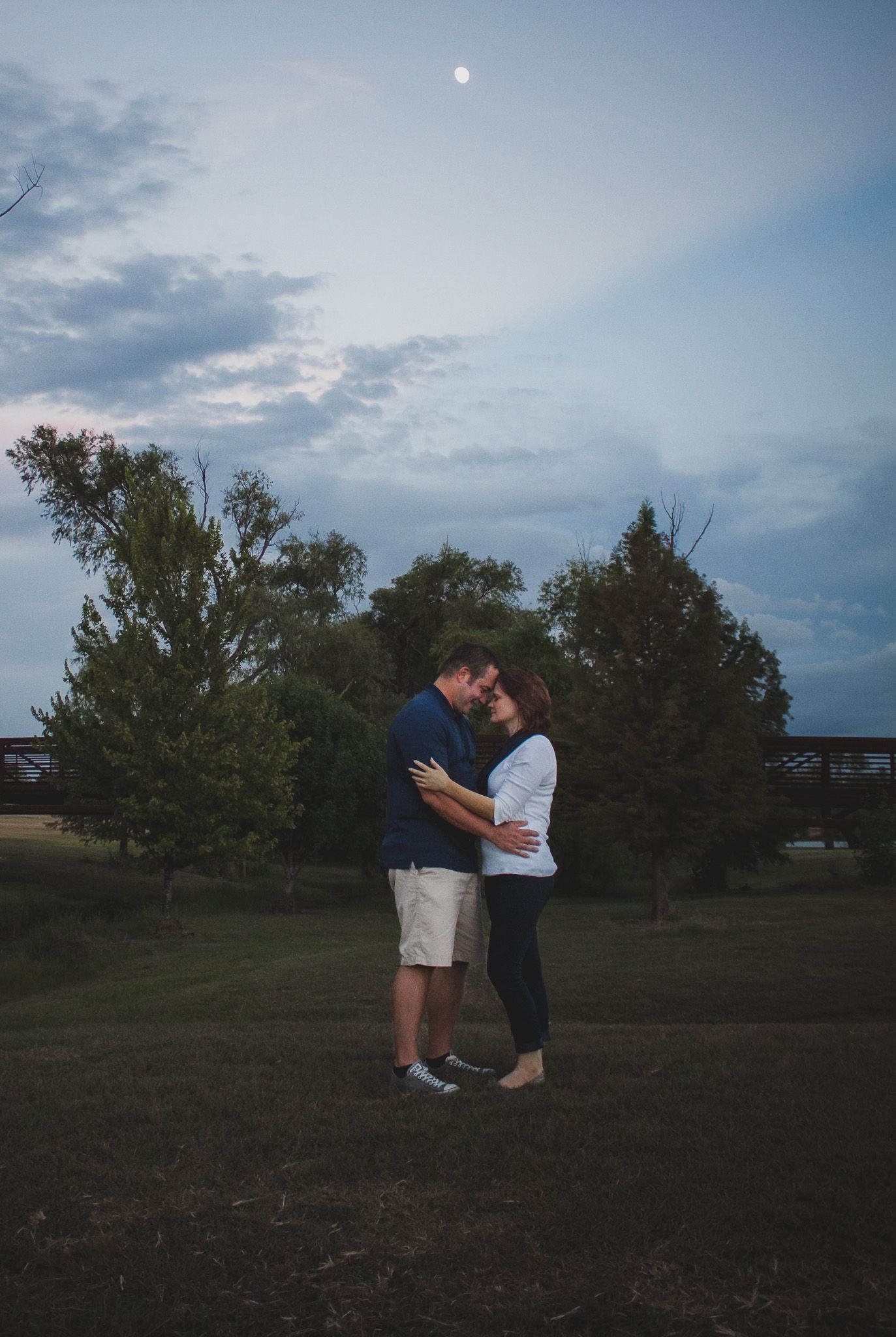 Couple sharing a quiet moment under a dramatic sky, natural light couples portrait, Finger Lakes NY, Soft Wild Light.