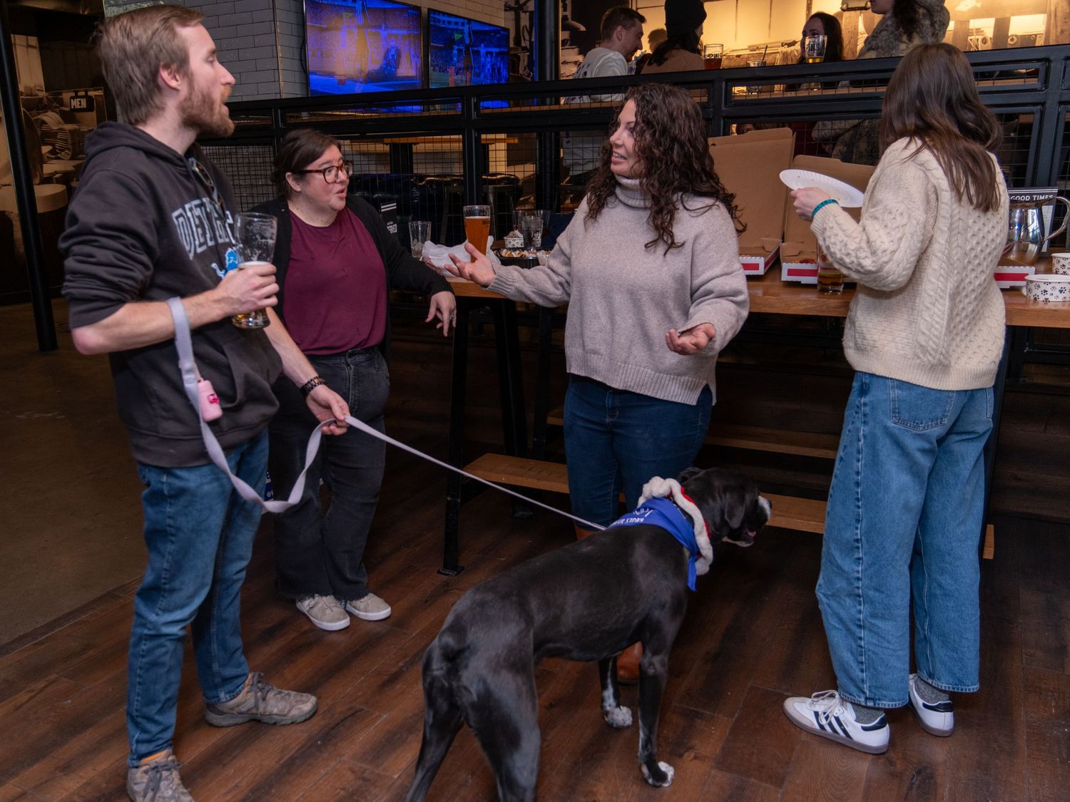 Event photograph from a holiday party benefitting an animal rescue organization.