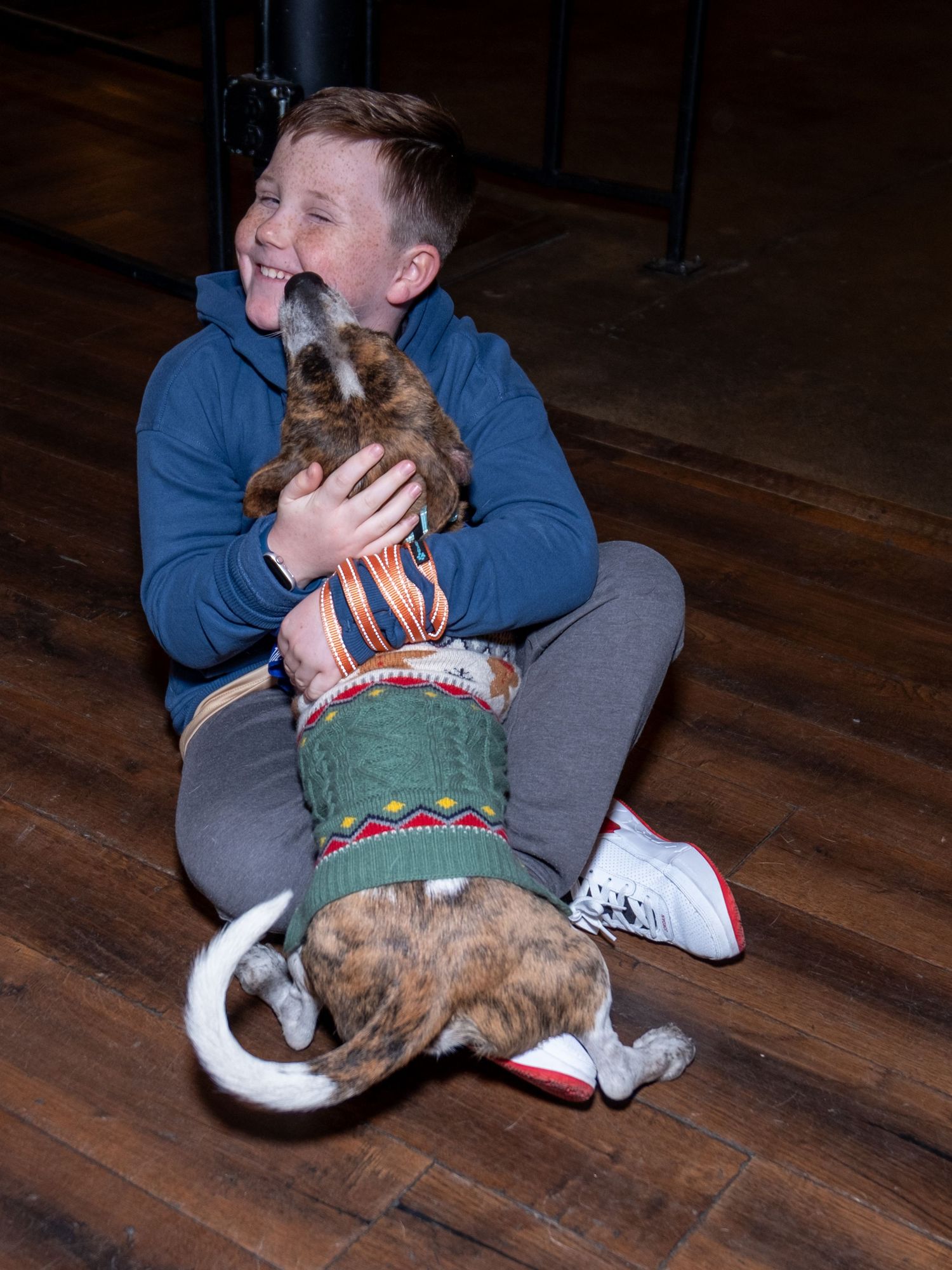 Event photograph from a holiday party benefitting an animal rescue organization.
