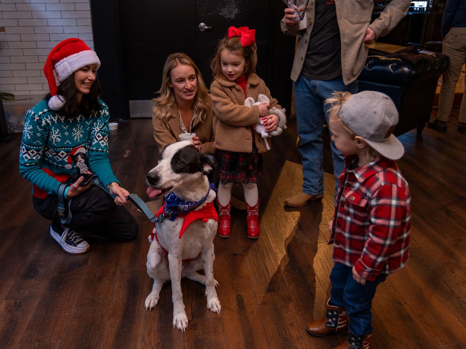 Event photograph from a holiday party benefitting an animal rescue organization.