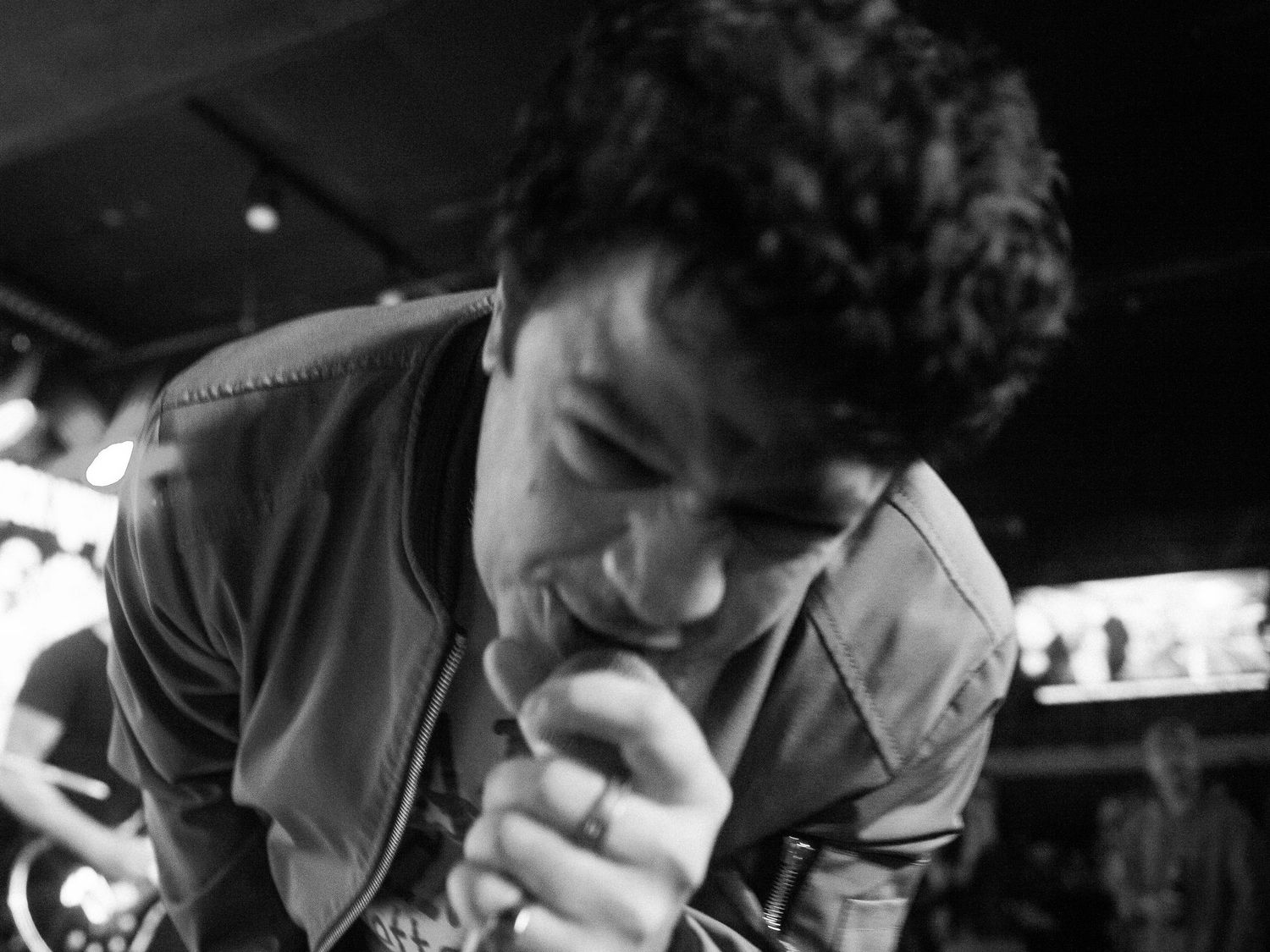 Black and white photograph of a live music event.