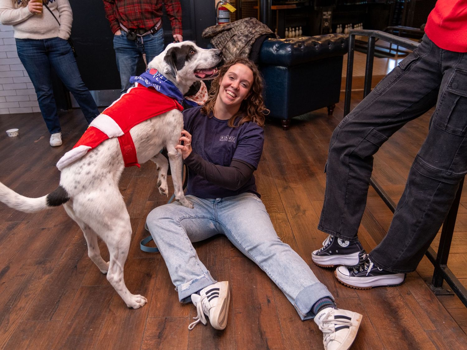 Event photograph from a holiday party benefitting an animal rescue organization.