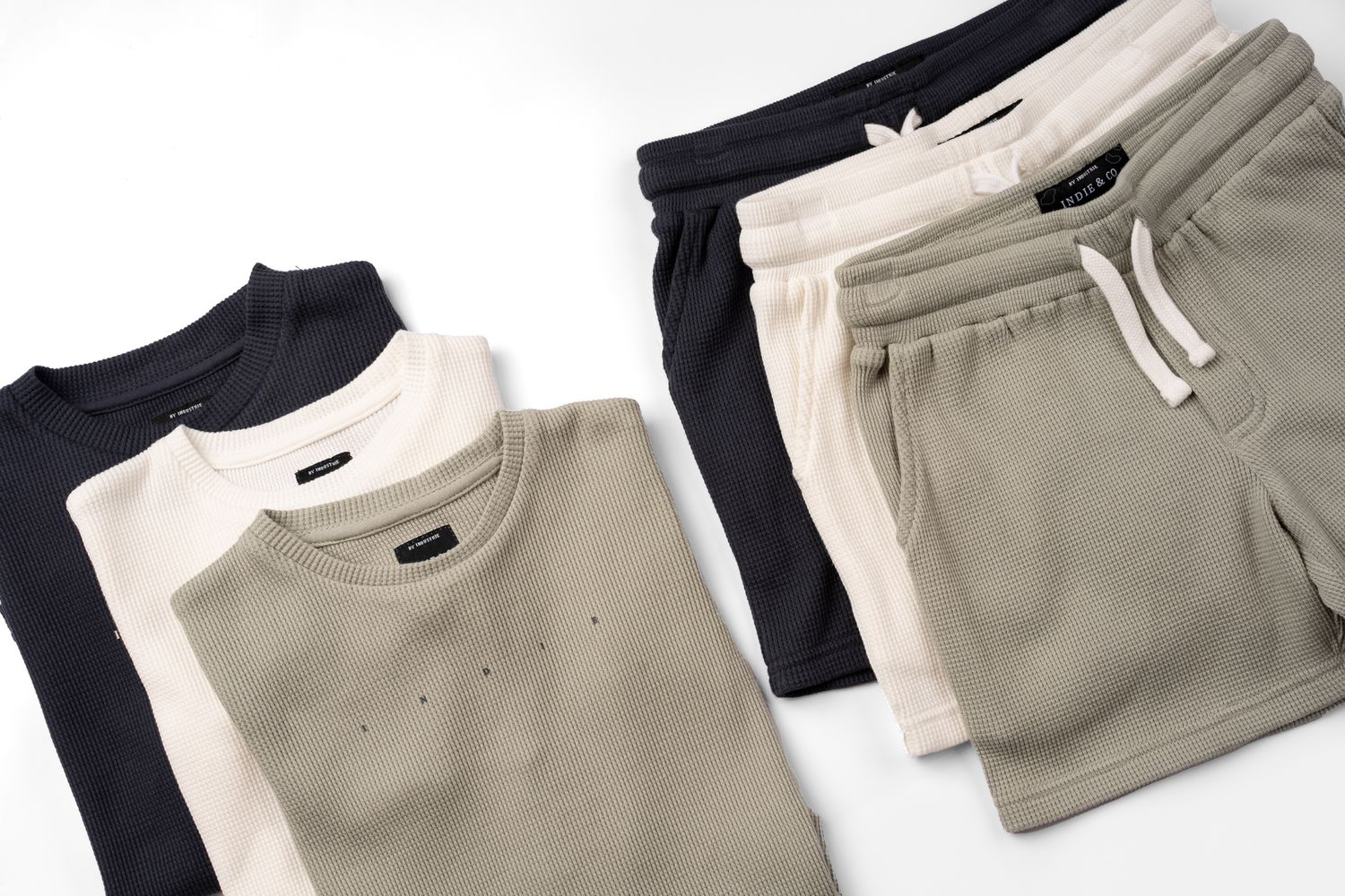 Beige sweatshirt and sweatpants set displayed in multiple angles showing details of casual loungewear ensemble.