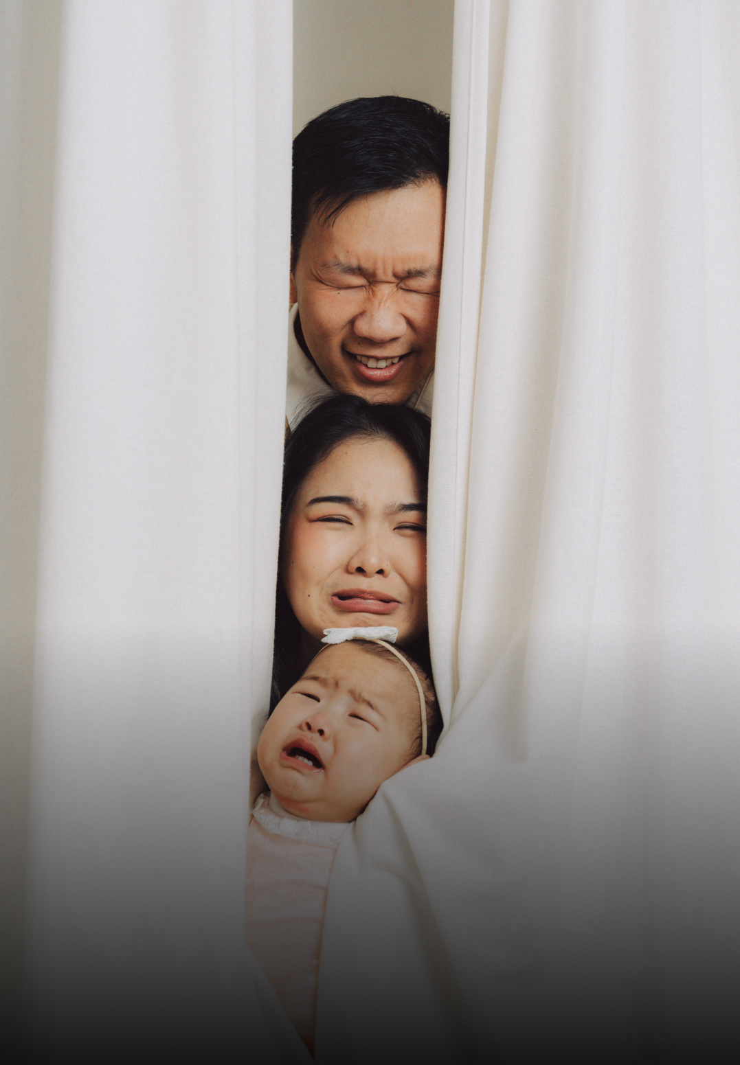 Playful photo sequence showing people peeking through white curtains with expressive faces.