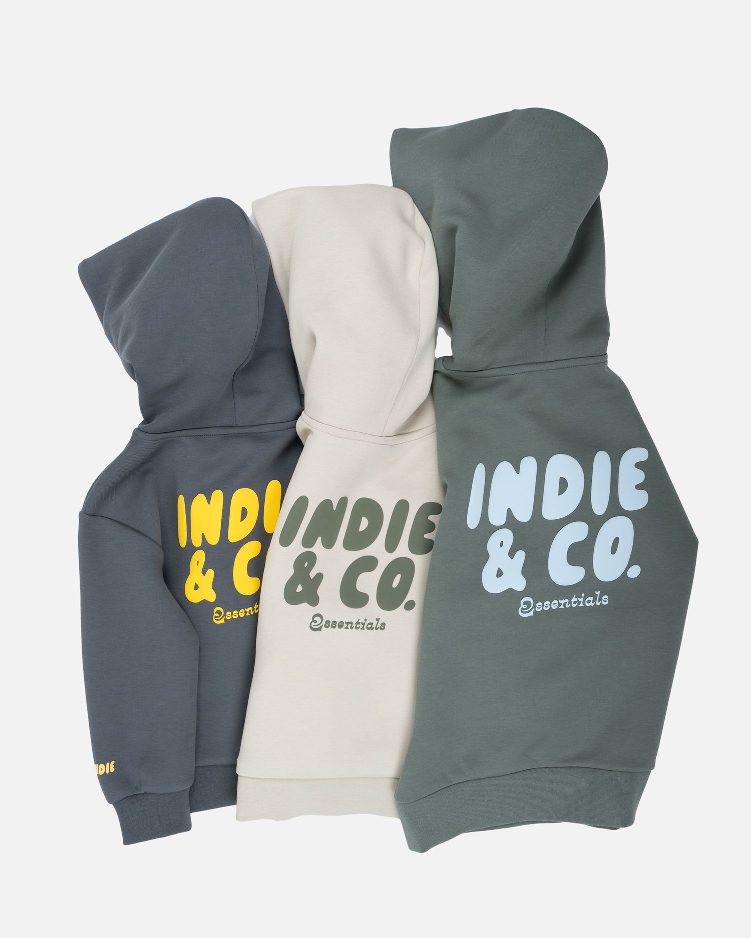 Display of hooded sweatshirts featuring Indie & Co branding in navy, cream and sage colors.