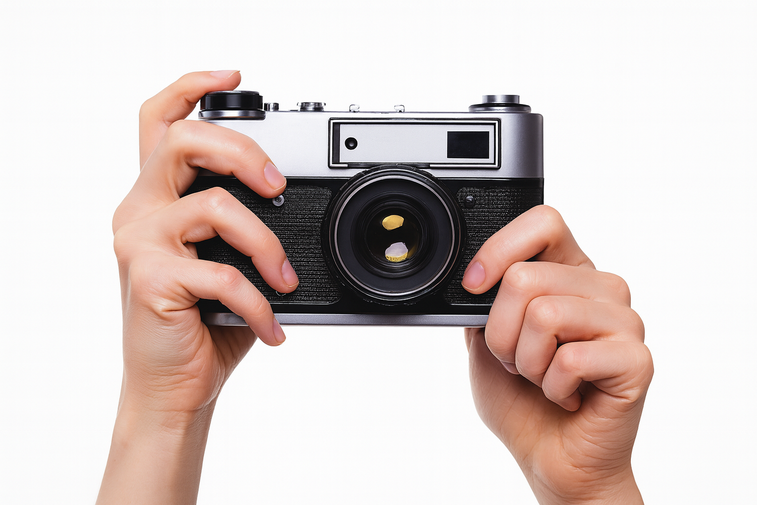 Hands holding a vintage rangefinder camera with black and silver body against white background.