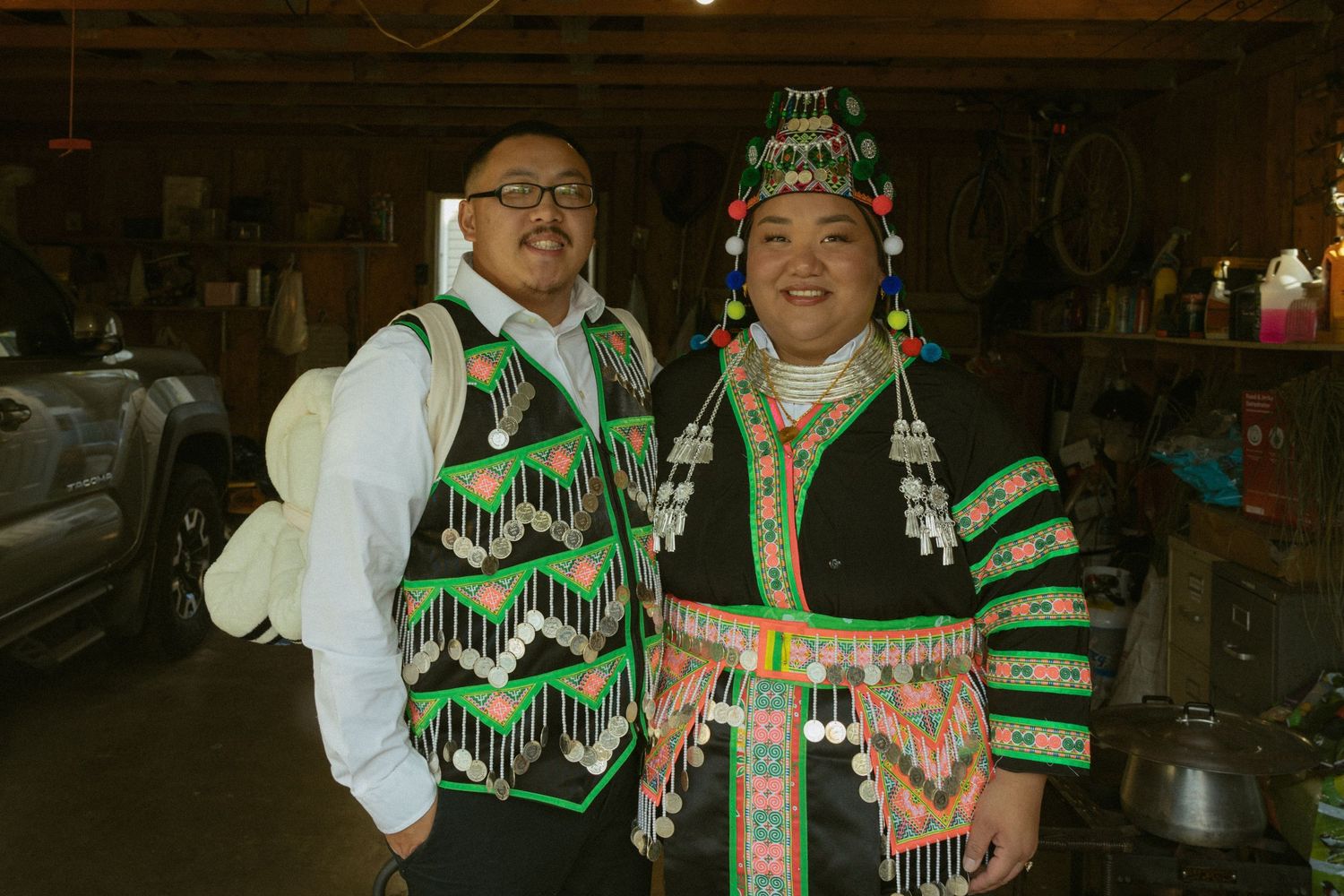 People celebrating at a festive gathering wearing green and white attire with drinks and decorations.