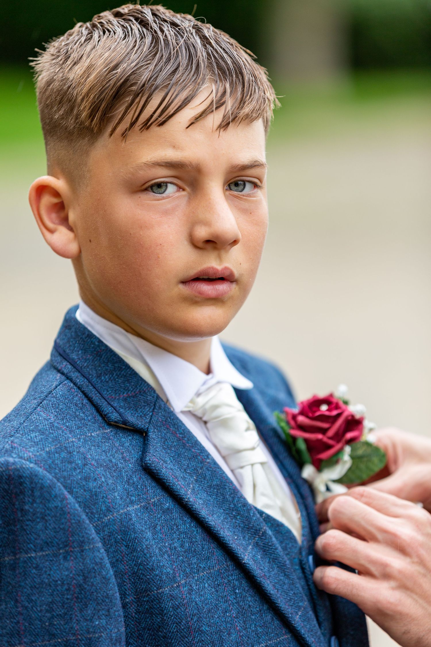 Young page boy portrait at Redworth Hall Hotel, a natural and candid wedding moment capturing emotion, detail and timeless North East style.
