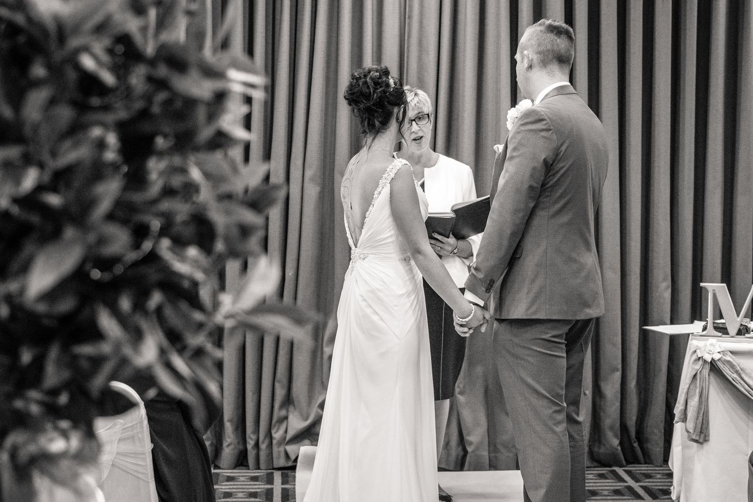 Bride and groom exchange vows at Holiday Inn Washington UK, a modern North East wedding venue with elegant ceremony rooms and stylish interi