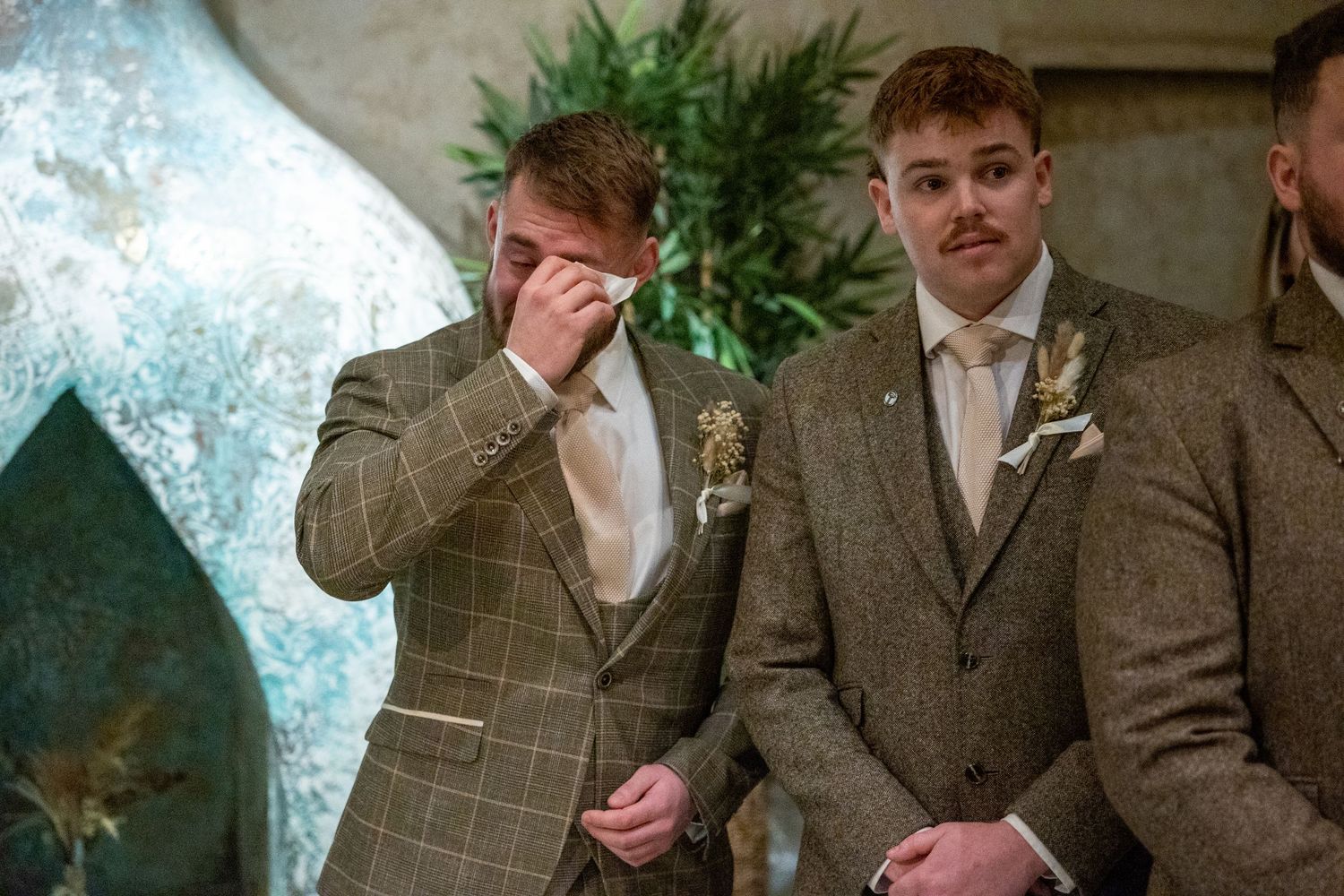 Groomsmen show emotion during ceremony at Runa Farm, heartfelt North East UK wedding moment with rustic setting and natural candid style