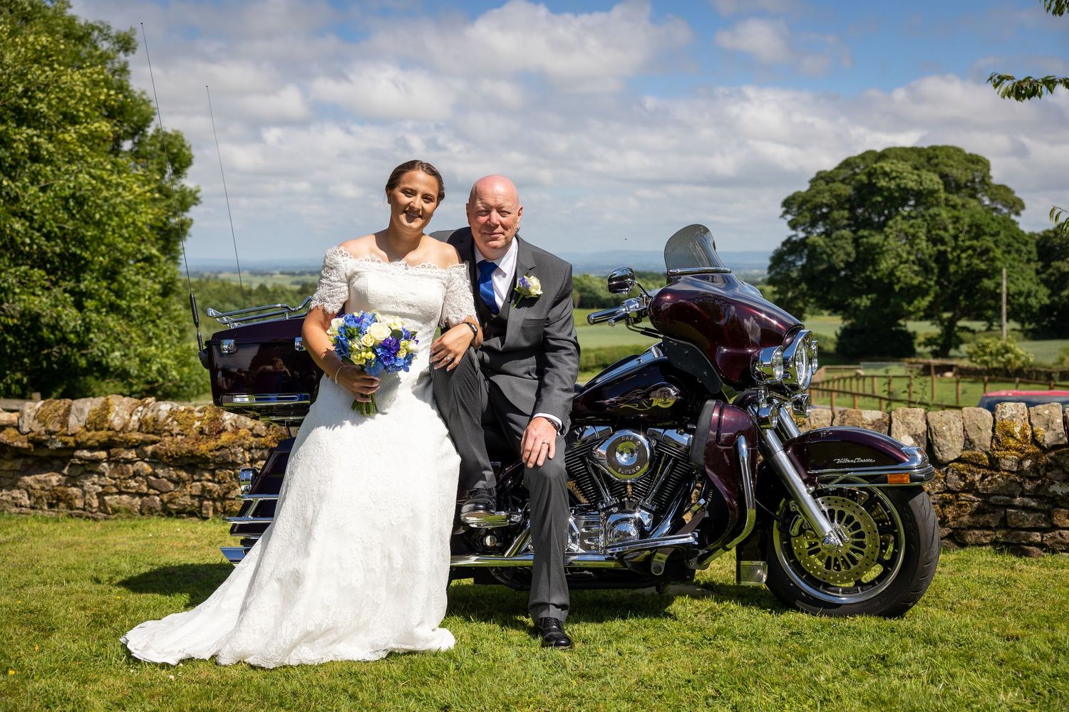 Bride and groom with vintage motorcycle in Richmond, scenic countryside wedding portrait with relaxed, stylish outdoor setting