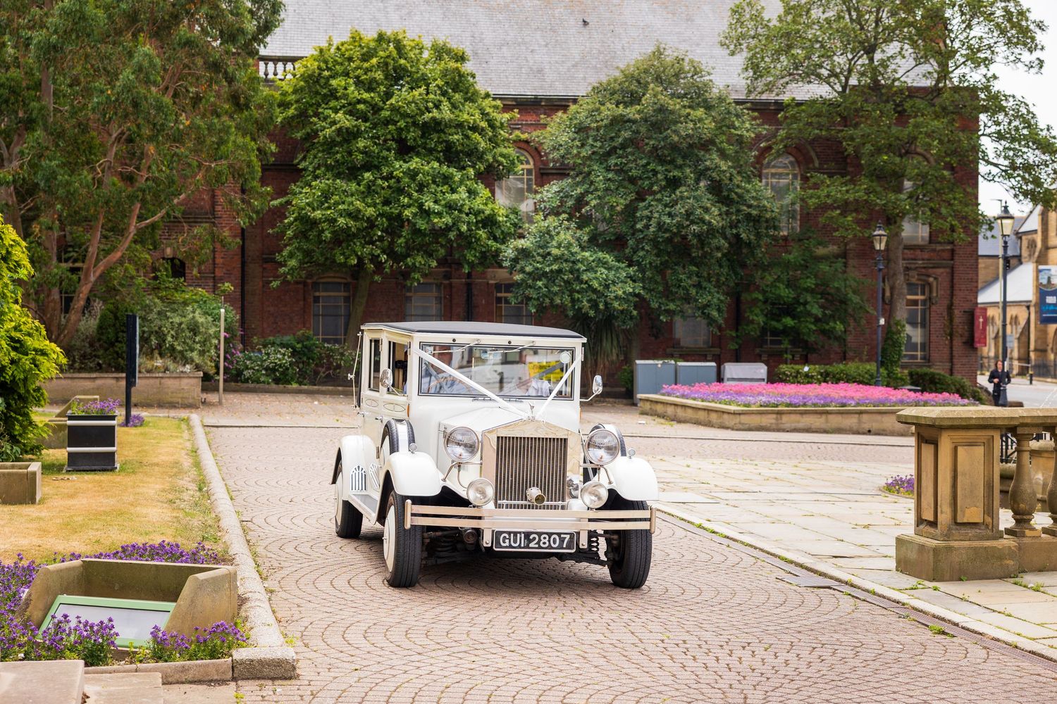 Vintage wedding car outside South Shields Registry Office; classic style, calm setting before ceremony.