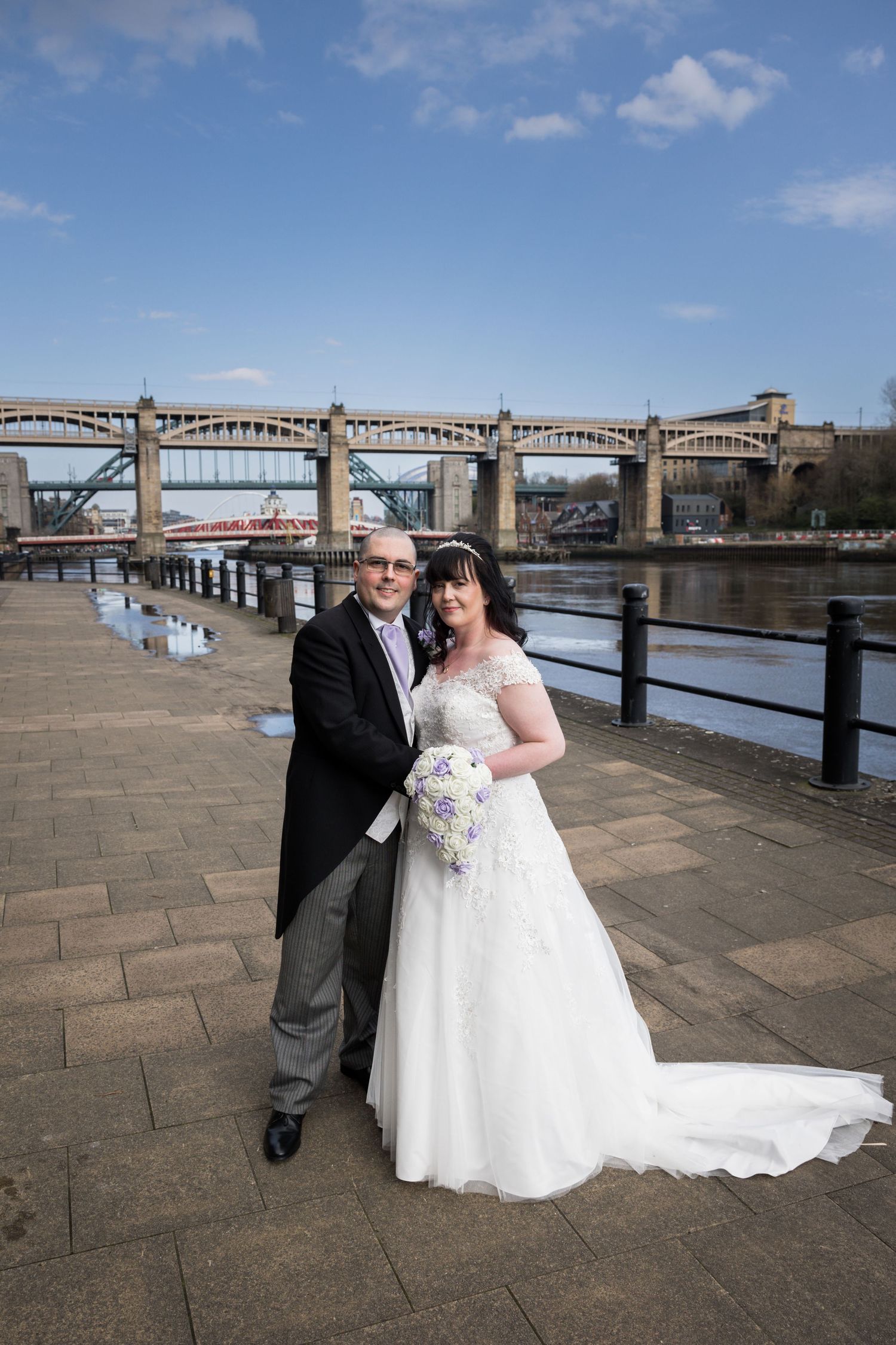 Bride and groom portrait on Newcastle Quayside near Hilton Newcastle Gateshead with Tyne Bridge backdrop and riverside views