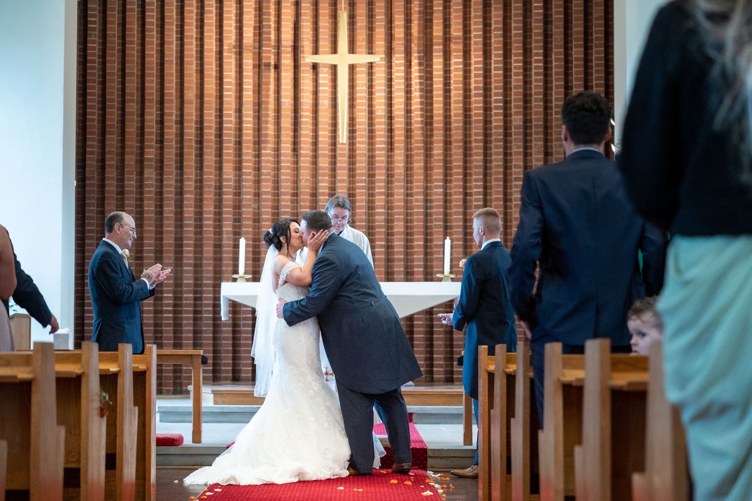 Bride and groom exchange vows in a beautiful church ceremony, a heartfelt wedding moment captured with love, emotion and timeless elegance.