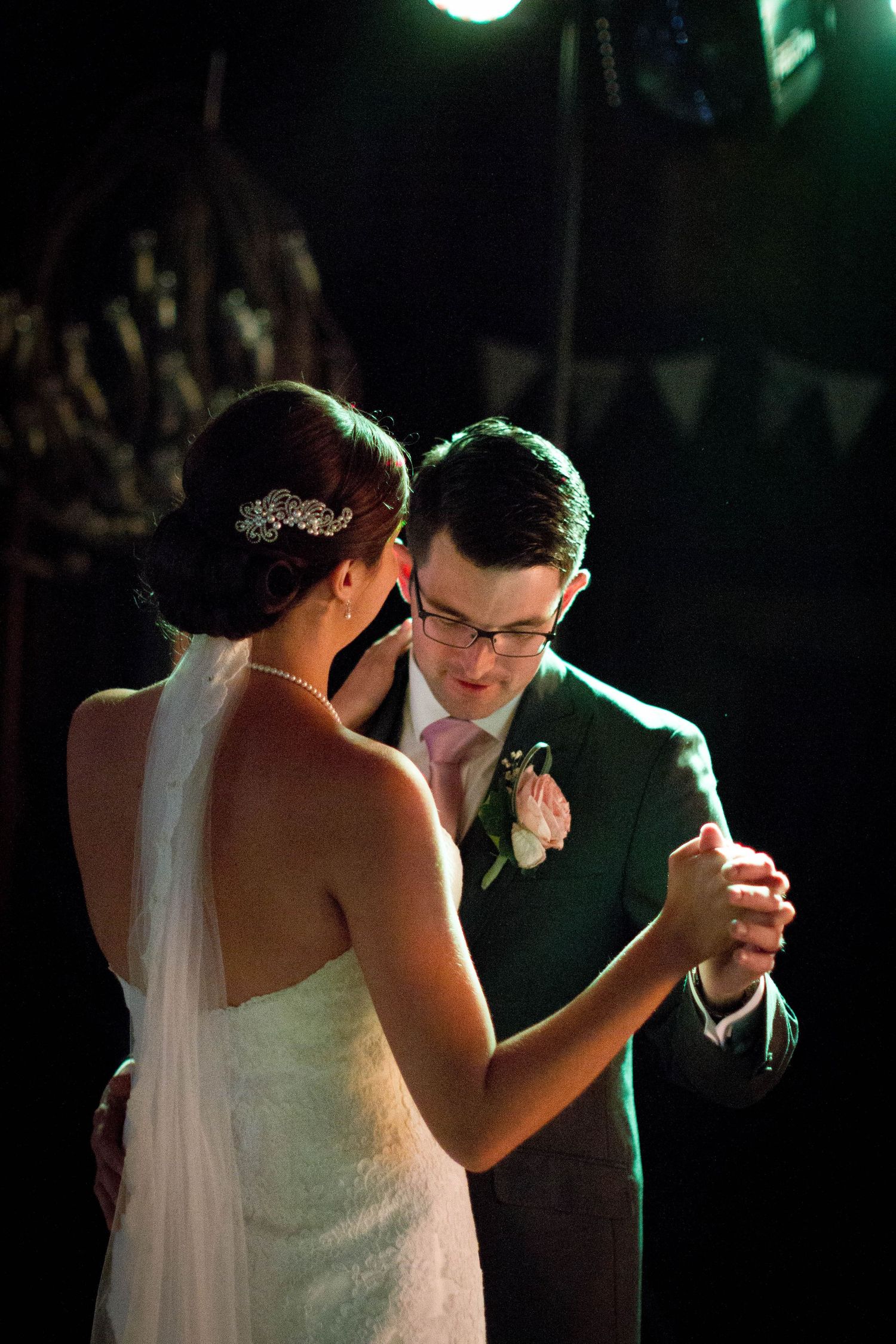 Romantic first dance at Gosforth Hall Hotel, with the couple softly lit under evening lights, sharing an intimate wedding moment.