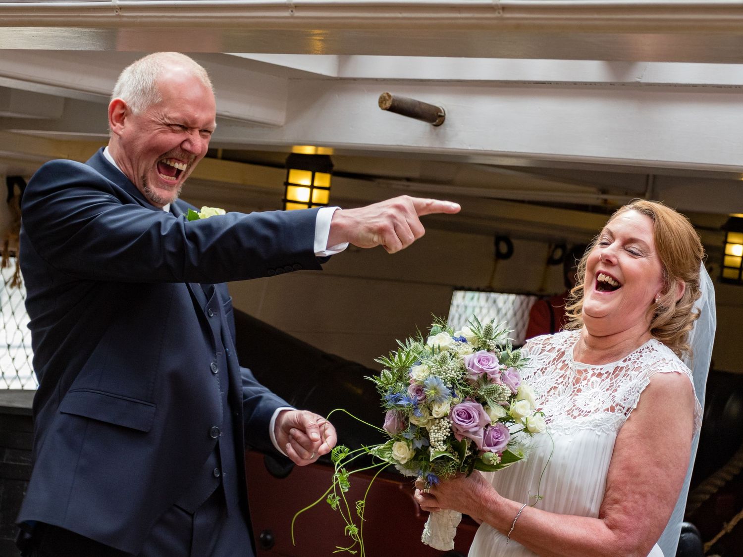 Bride and groom sharing a joyful laugh during their wedding day celebration Trincomalee