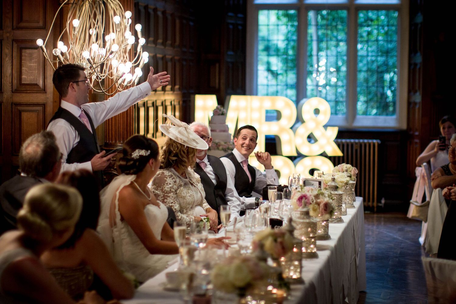 Wedding speeches at Gosforth Hall Hotel, with guests laughing and enjoying heartfelt moments during the reception.