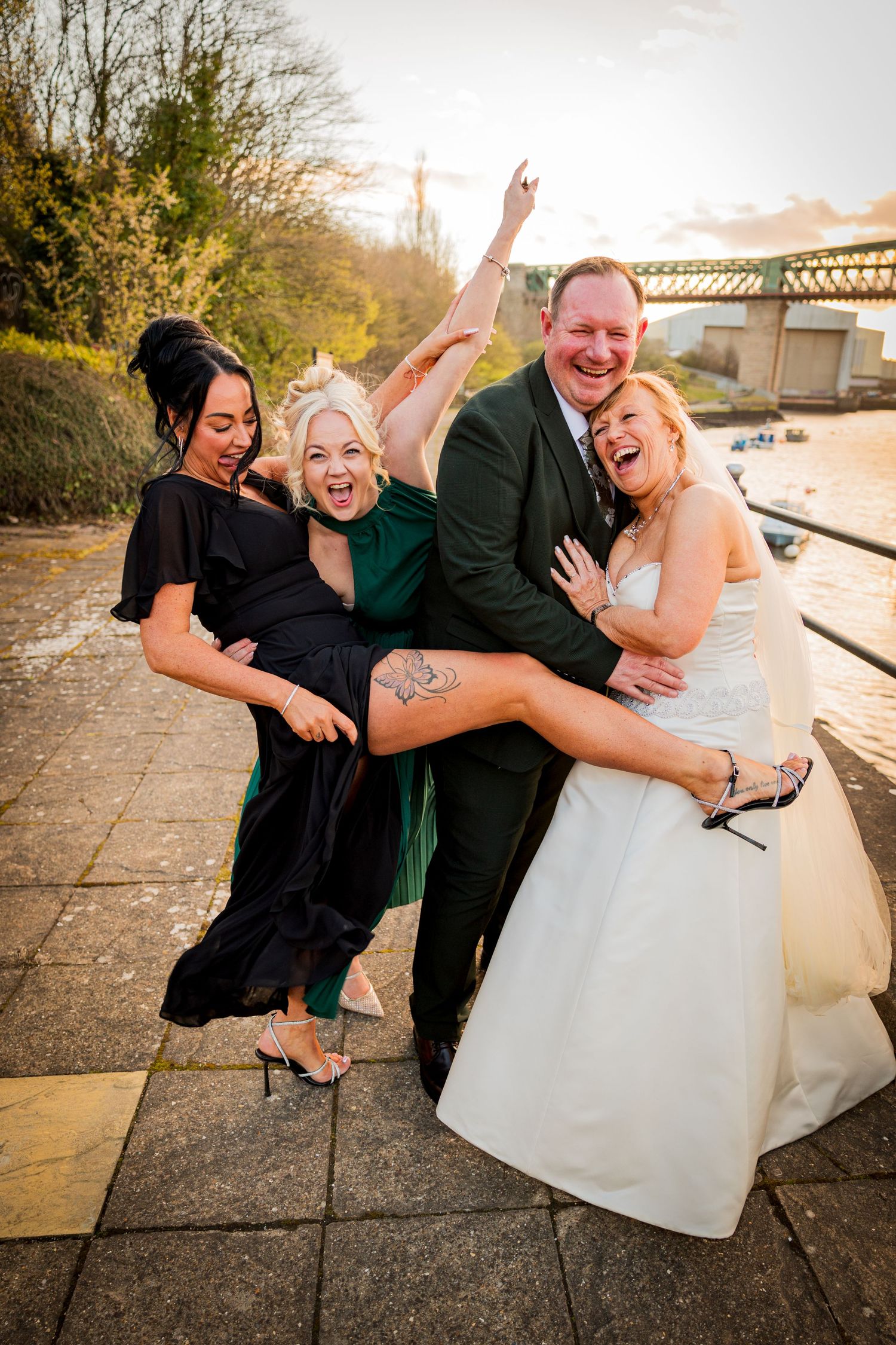 Fun group moment at The Ropery, Sunderland; bride and friends laughing and celebrating by the riverside.