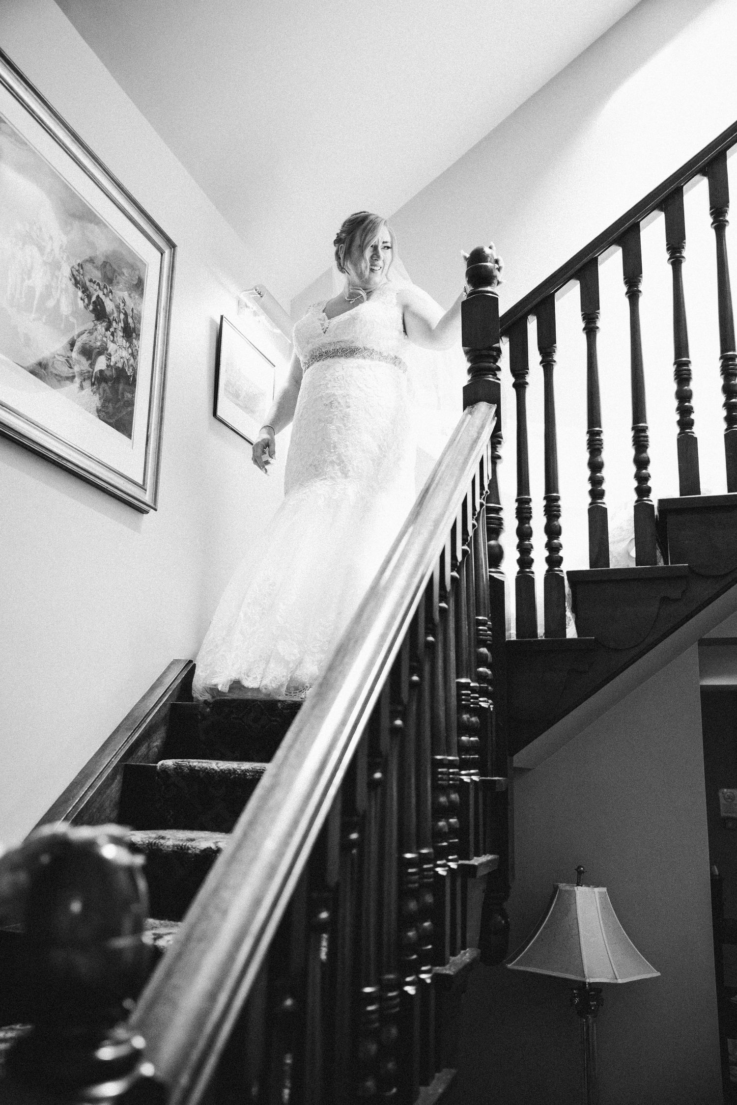 Bride walking down stairs in black and white Ramside Hall Durham