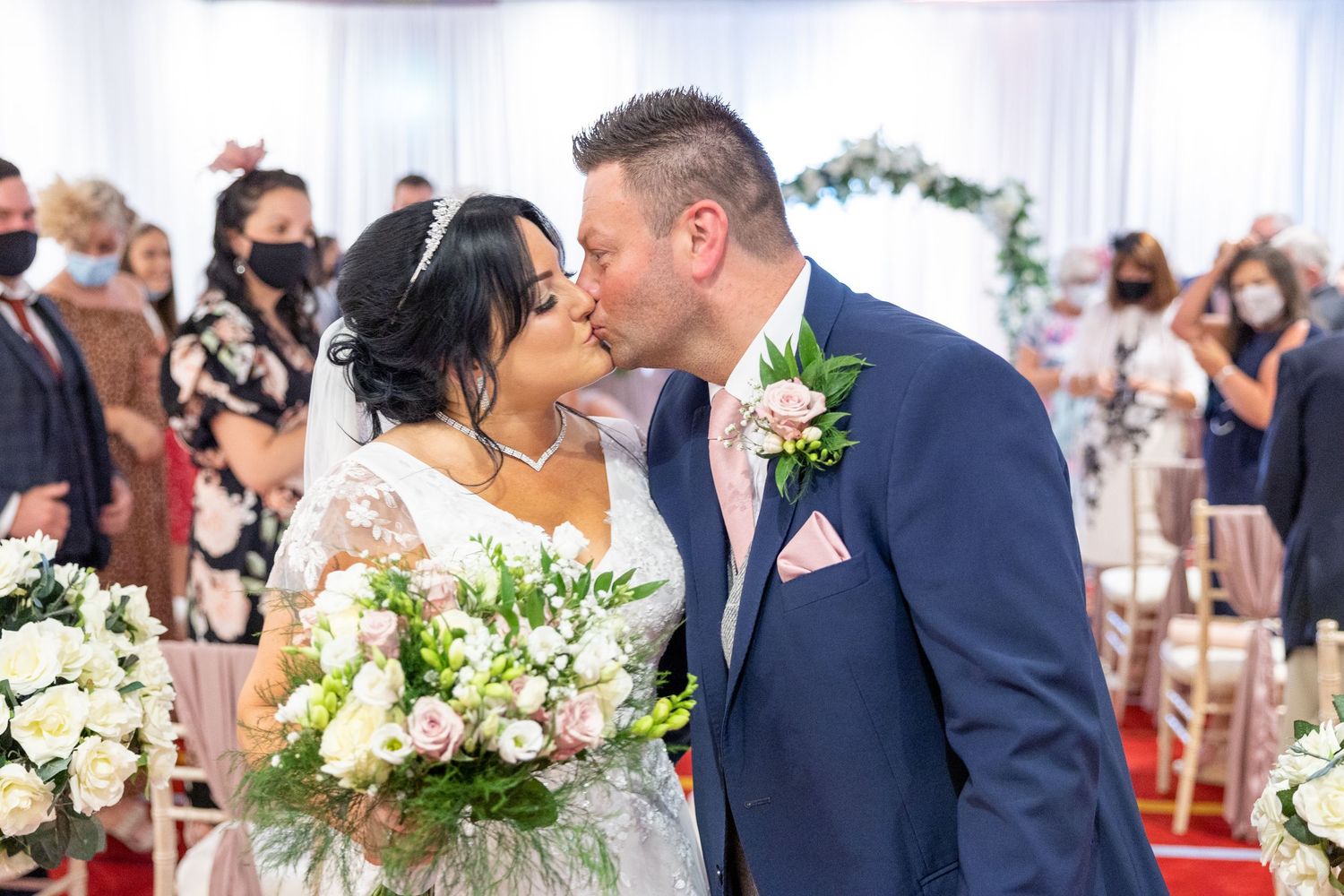 Bride and groom first kiss