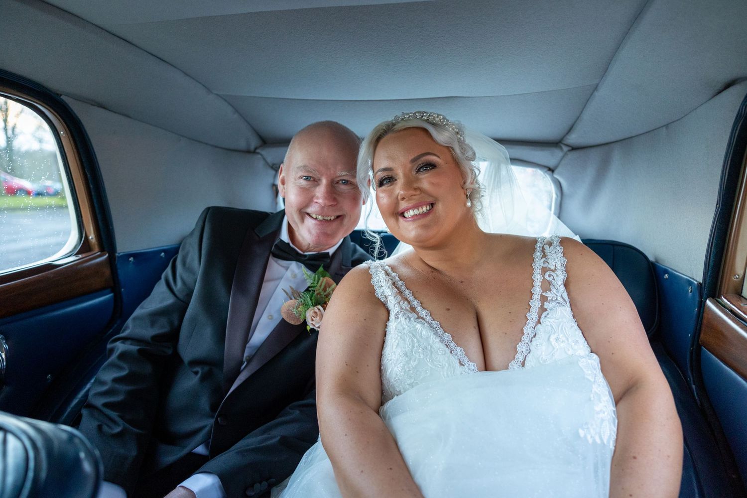 Father of the bride and bride in vintage wedding car, emotional moment with proud dad and smiling bride on elegant UK wedding day