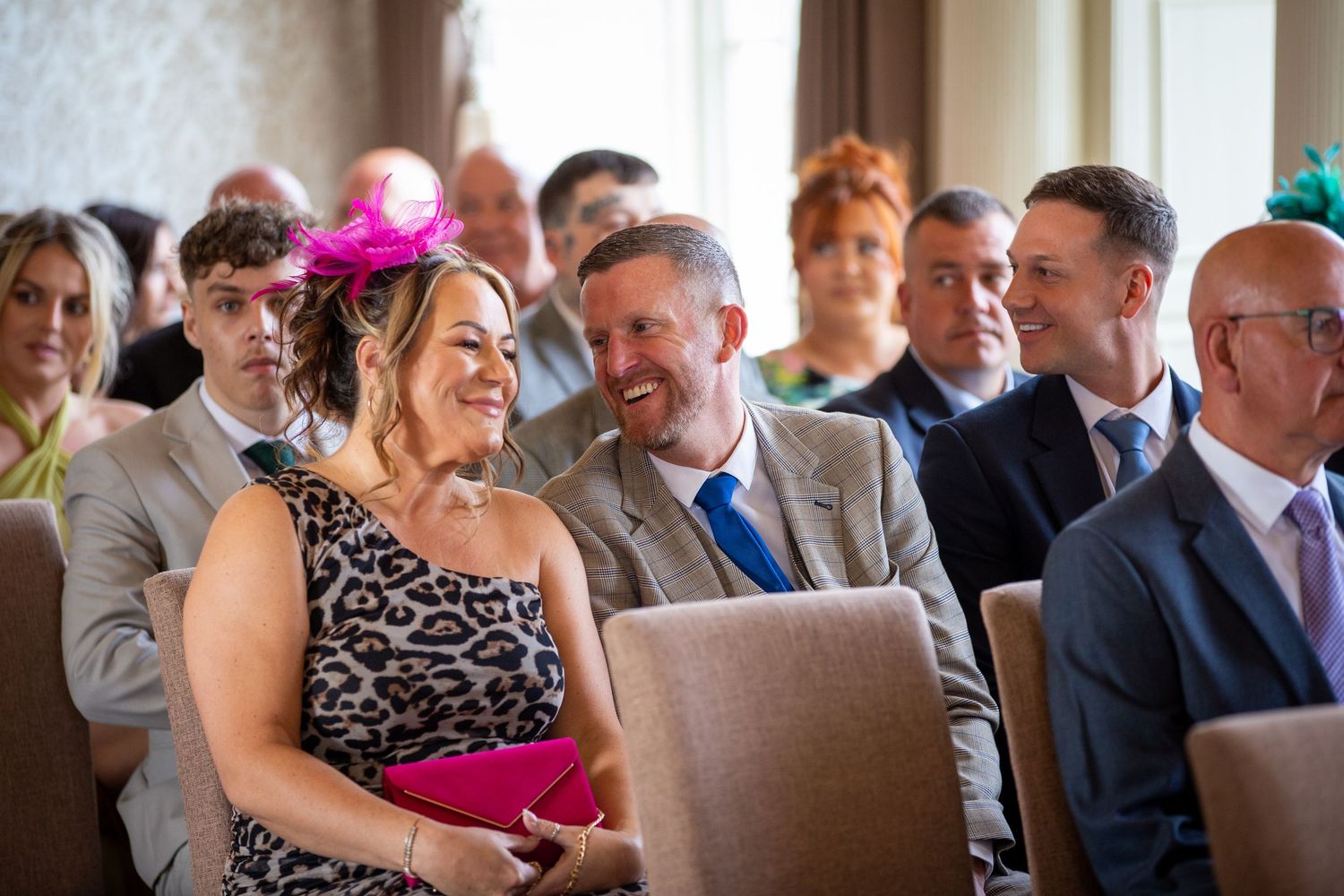 Guests share a laugh at North Shields Registry Office; candid moment during the ceremony.